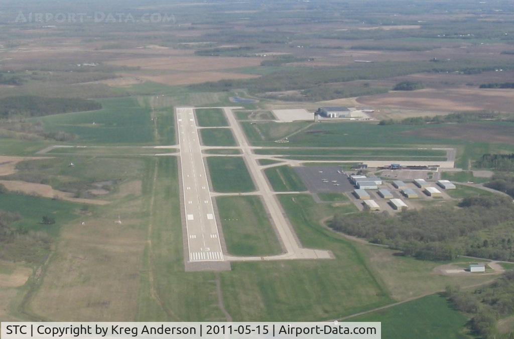 St Cloud Regional Airport (STC) - Departing St. Cloud Regional Airport after departing runway 5. Looking towards the southeast.