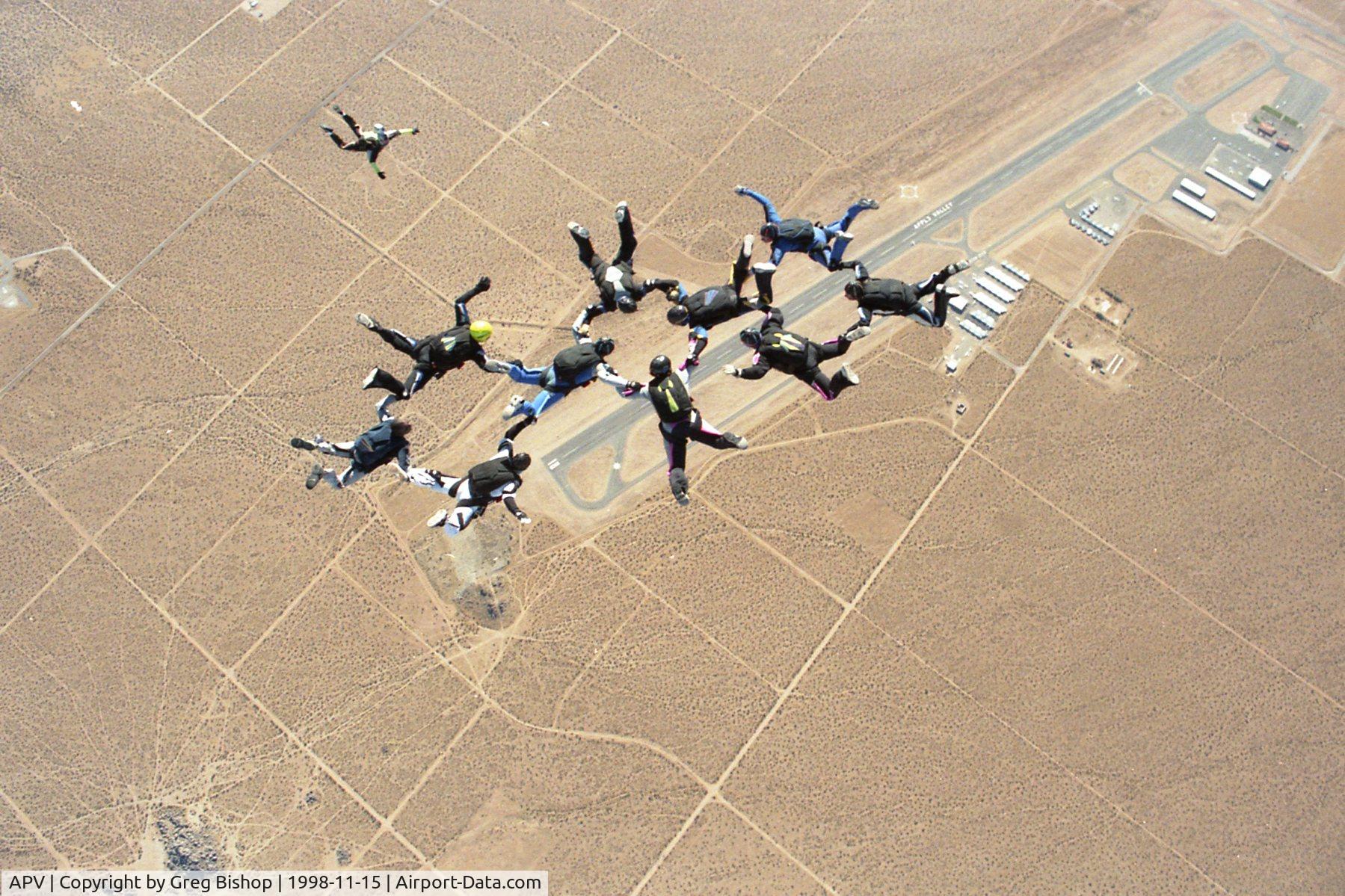Apple Valley Airport (APV) - Aerial view of the Apple Valley Airport.  Photo was taken 15 Nov 1998 of a 10-Way skydiving formation from when Apple Valley Skydive was still in operation back then.