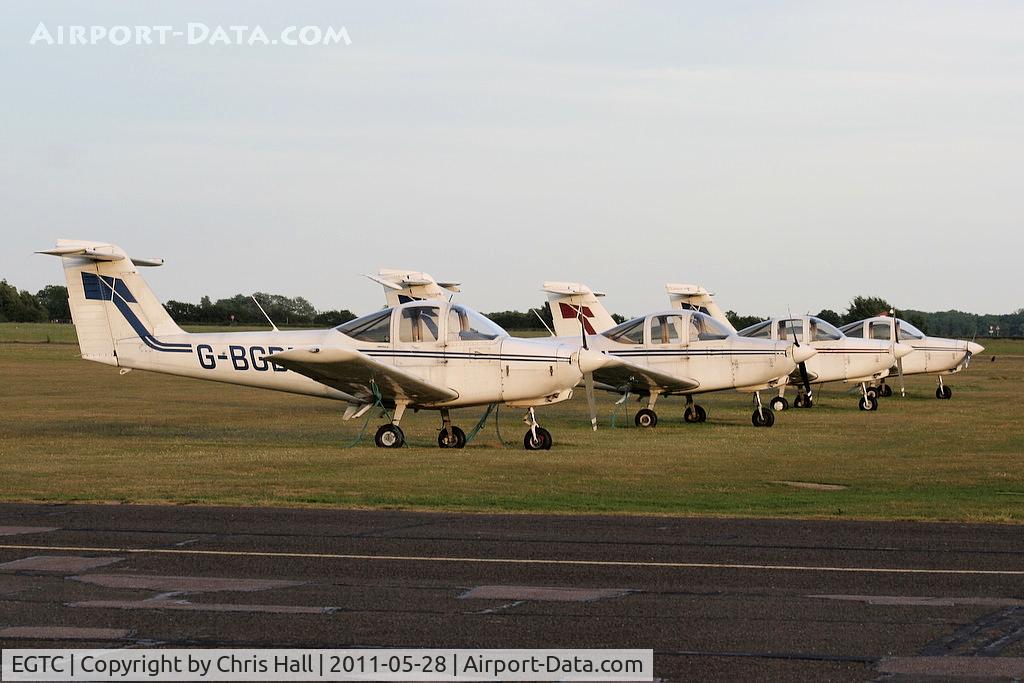 Cranfield Airport, Cranfield, England United Kingdom (EGTC) - PA-38's lined up at Cranfield