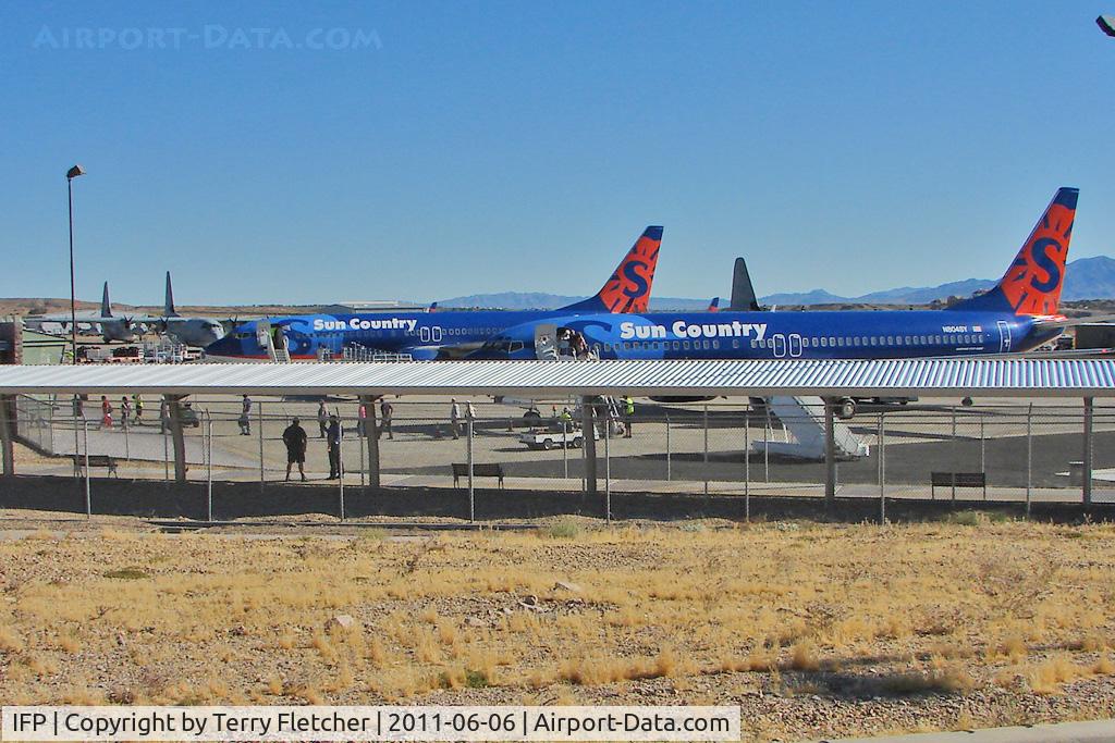 Laughlin/bullhead International Airport (IFP) - Two Sun Country B737s and Three US Marines Hercules on the Bullhead / Laughlin apron