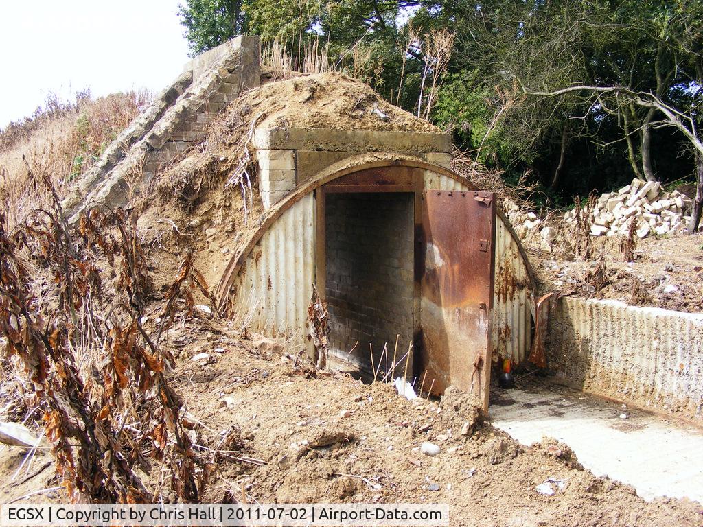North Weald Airfield Airport, North Weald, England United Kingdom (EGSX) - WWII air raid shelter at the rear of one of the E pens at North Weald Airfield