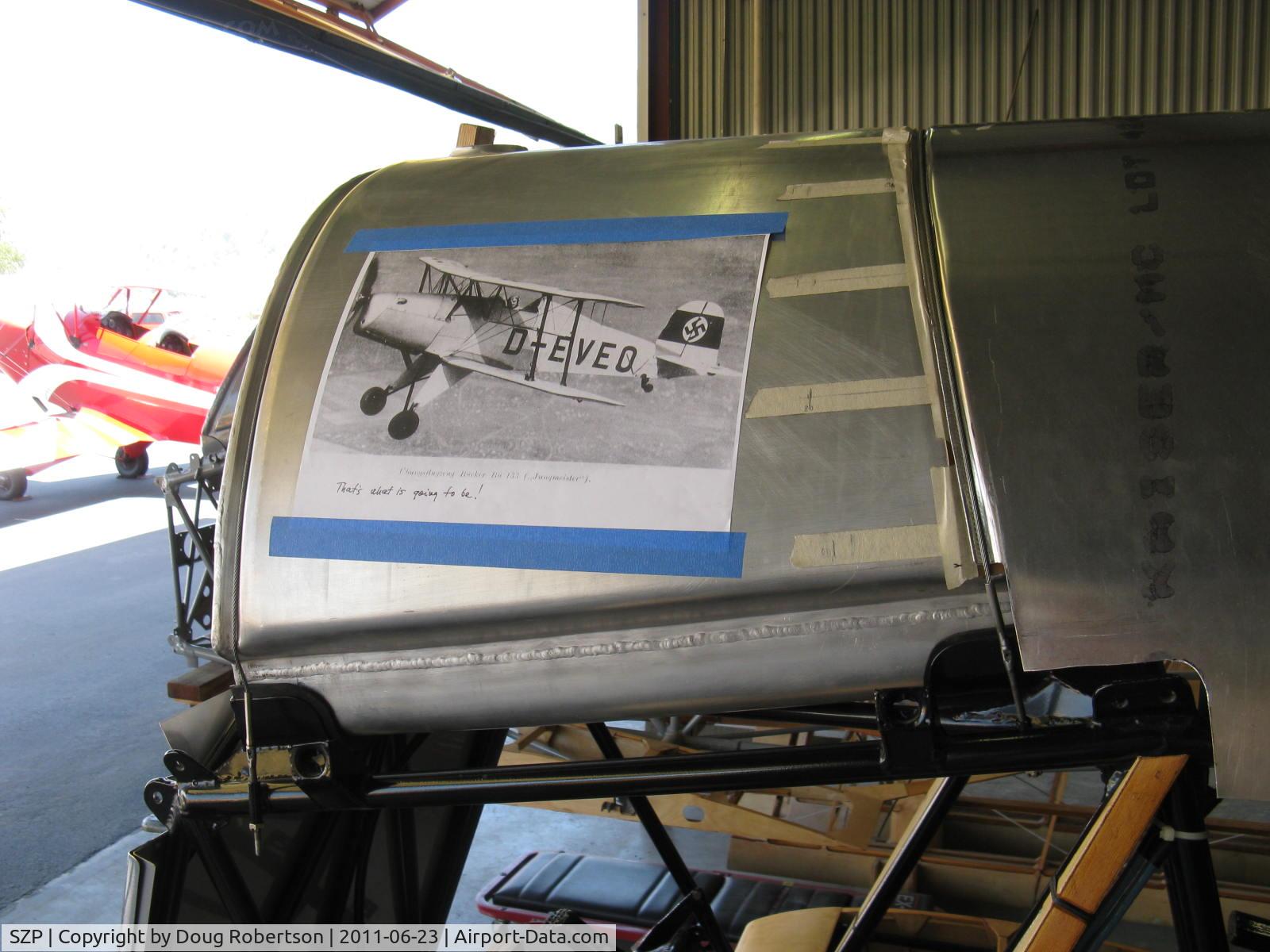 Santa Paula Airport (SZP) - Joe Krybus Bucker Shop-Jungmeister fuselage in build with photo preview of coming Jungmeister attraction.