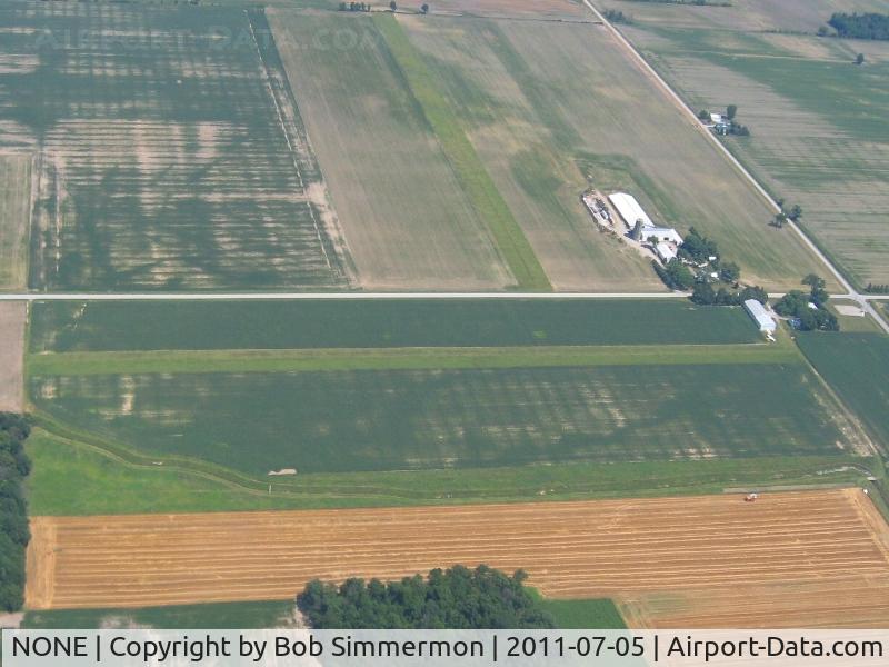 NONE Airport - Looking east at two uncharted farm strips on Co. Rc. 294 east of Vickery, Ohio.  N-S runway on this side of the road, E-W runway beyond.