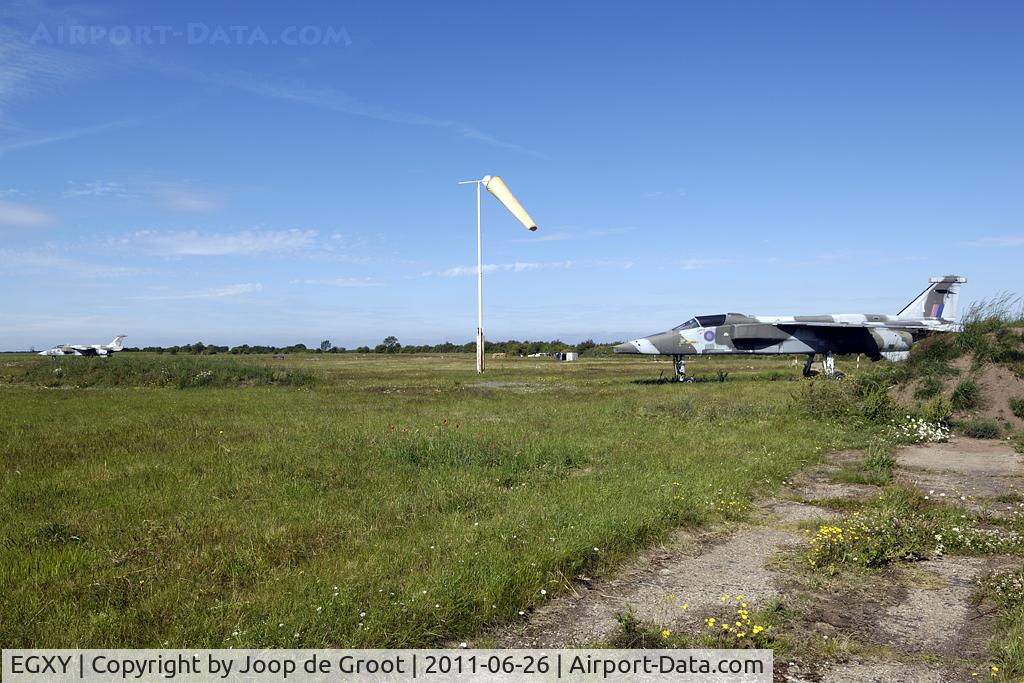 RAF Syerston Airport, Newark-on-Trent, England United Kingdom (EGXY) - two instructional Jaguars parked on the far side of the base