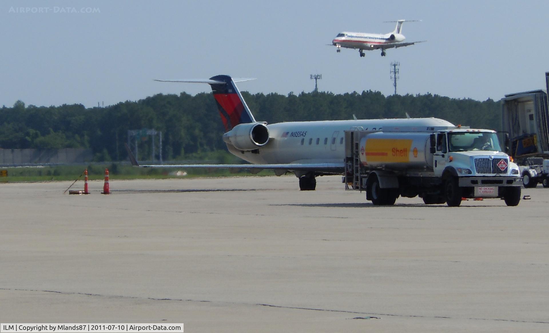 Wilmington International Airport (ILM) - Embraer 135 Landing, CL 600 at the gate.