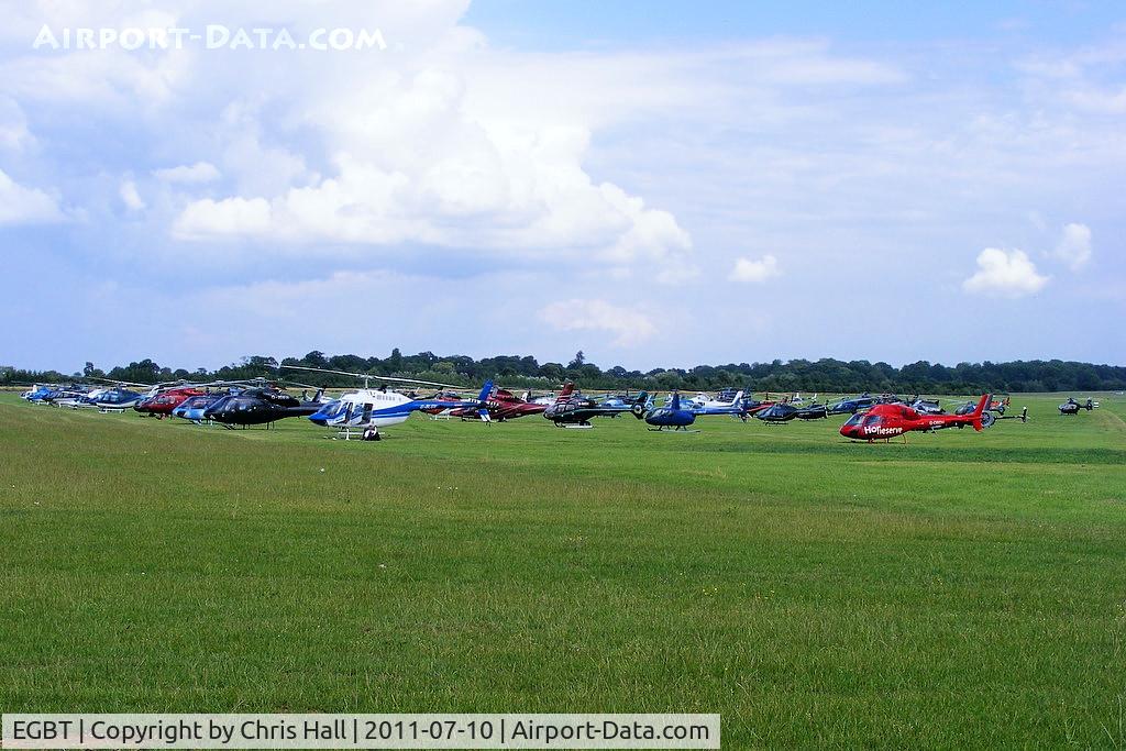 Turweston Aerodrome Airport, Turweston, England United Kingdom (EGBT) - Sixty helicopters at Turweston used for ferrying race fans to Silverstone for the British F1 Grand Prix
