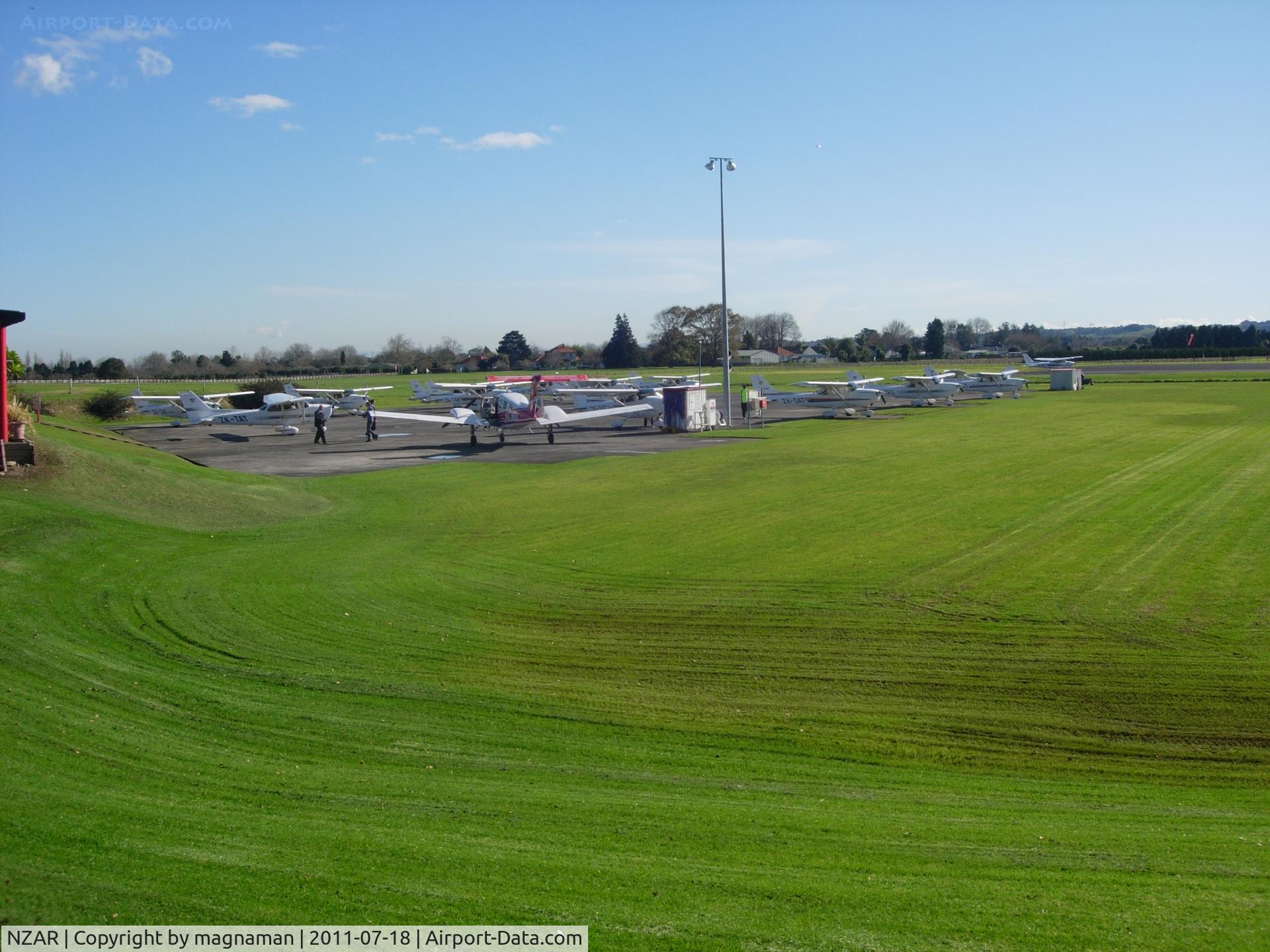 Ardmore Airport, Auckland New Zealand (NZAR) - View of flying club apron from within central area.
Great airport for viewing and photos - lots of places to park up.