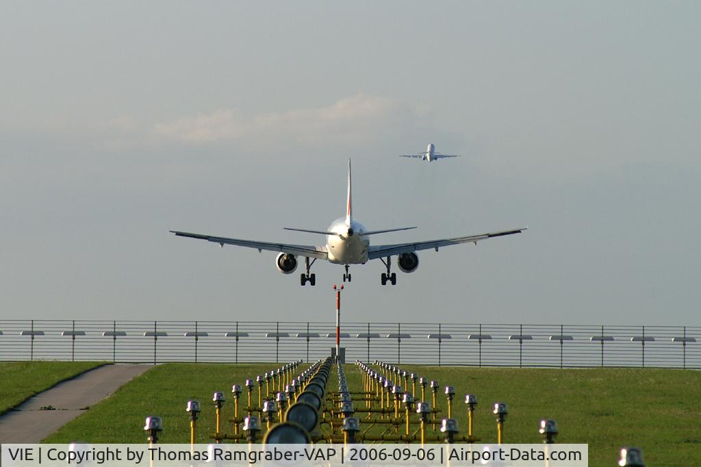 Vienna International Airport, Vienna Austria (VIE) - Air France A320-200 on final while an Austrian Arrows Fokker100 has just depatured