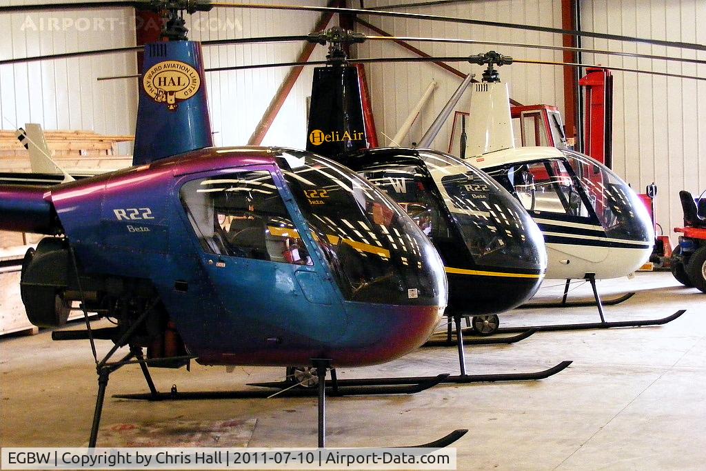 Wellesbourne Mountford Airfield Airport, Wellesbourne, England United Kingdom (EGBW) - R22's in the Heli Air hangar at Wellesbourne Mountford.
From front to rear, G-ZAPY, G-OSAZ and G-JHEW