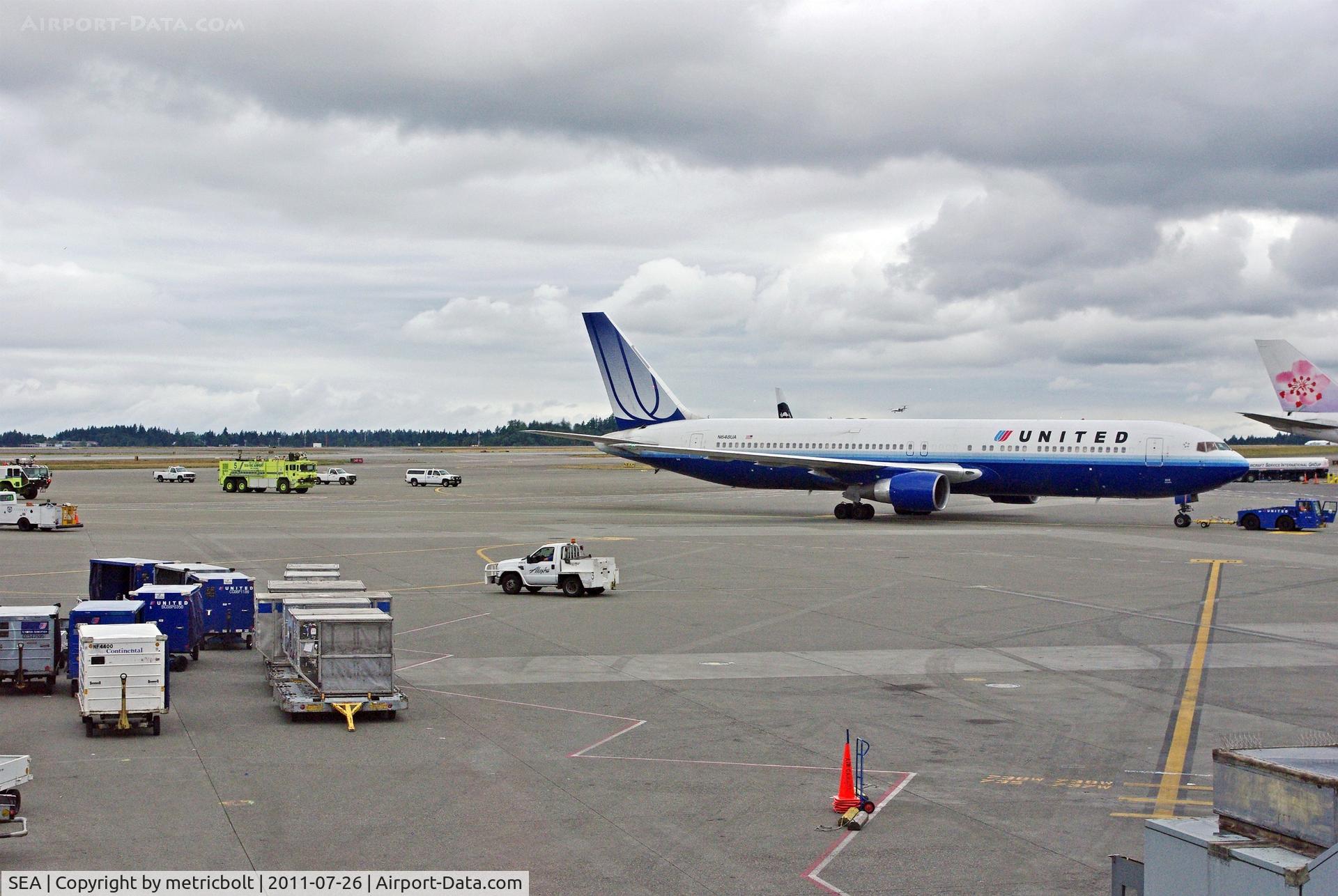 Seattle-tacoma International Airport (SEA) - Several fire trucks and emergency vehicles were following this UAL