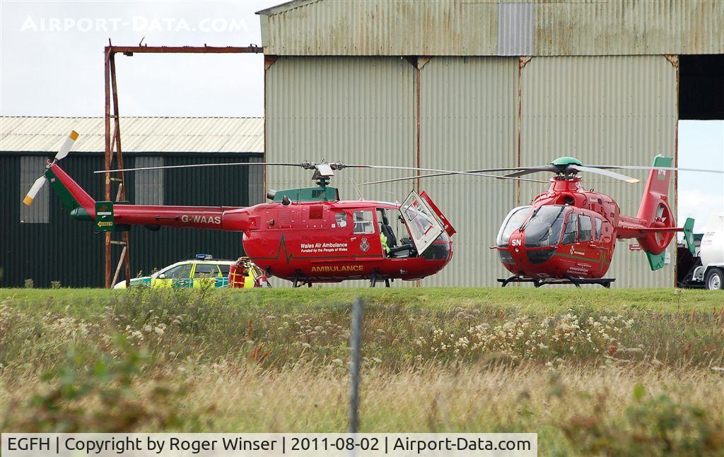 Swansea Airport, Swansea, Wales United Kingdom (EGFH) - Two Wales Air Ambulance helicopters at the air ambulance base.