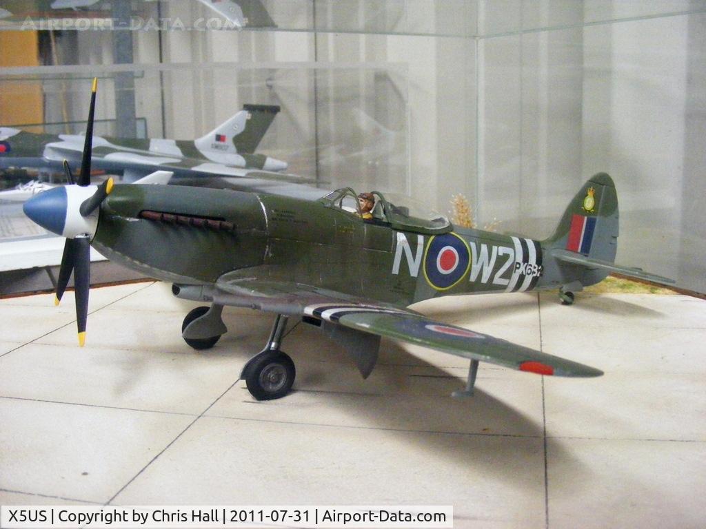 X5US Airport - Model of Spitfire F.Mk.24 painted to represent PK682 of 80 Sqn, RAuxAF, Hong Kong Auxillary Air Force, Kai-Tak, Hong-Kong, 1948-1954.