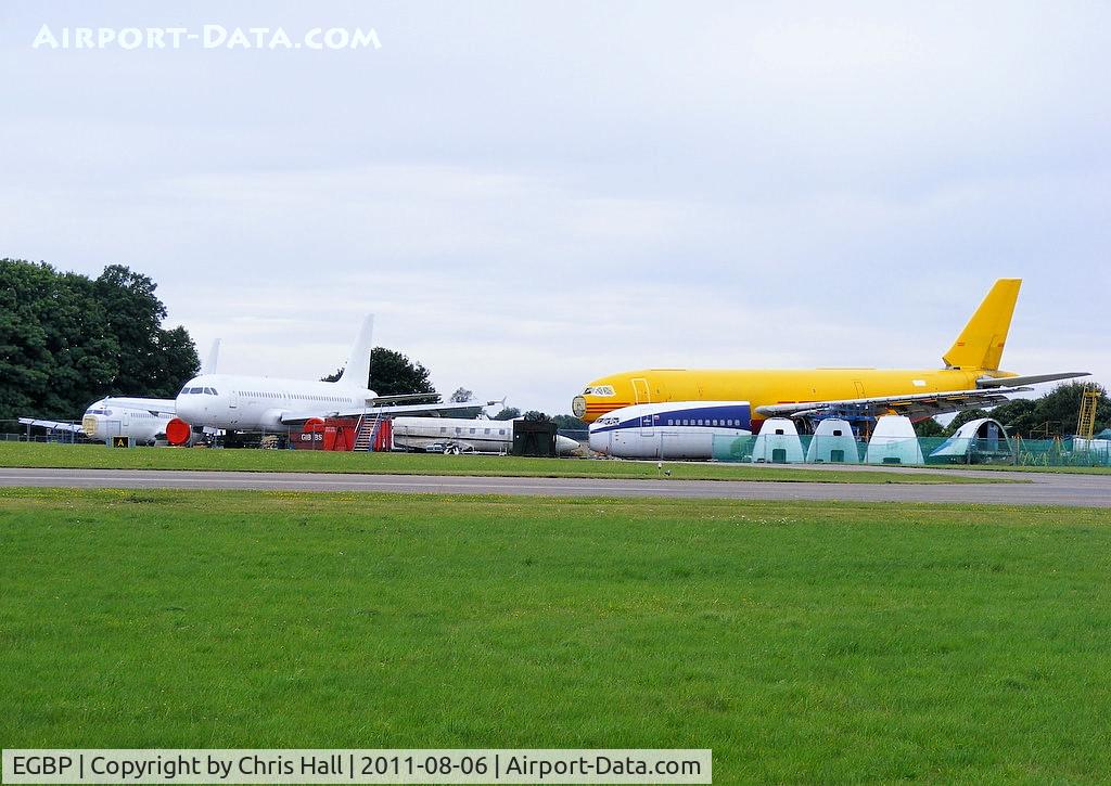 Kemble Airport, Kemble, England United Kingdom (EGBP) - Germania B737 D-ADIH, Air France A320 F-GHQH,  Lockheed Jetstar  N25AG, KD Avia B737 VP-BJX and DHL A300 EI-OZA in the scrapping area at Kemble