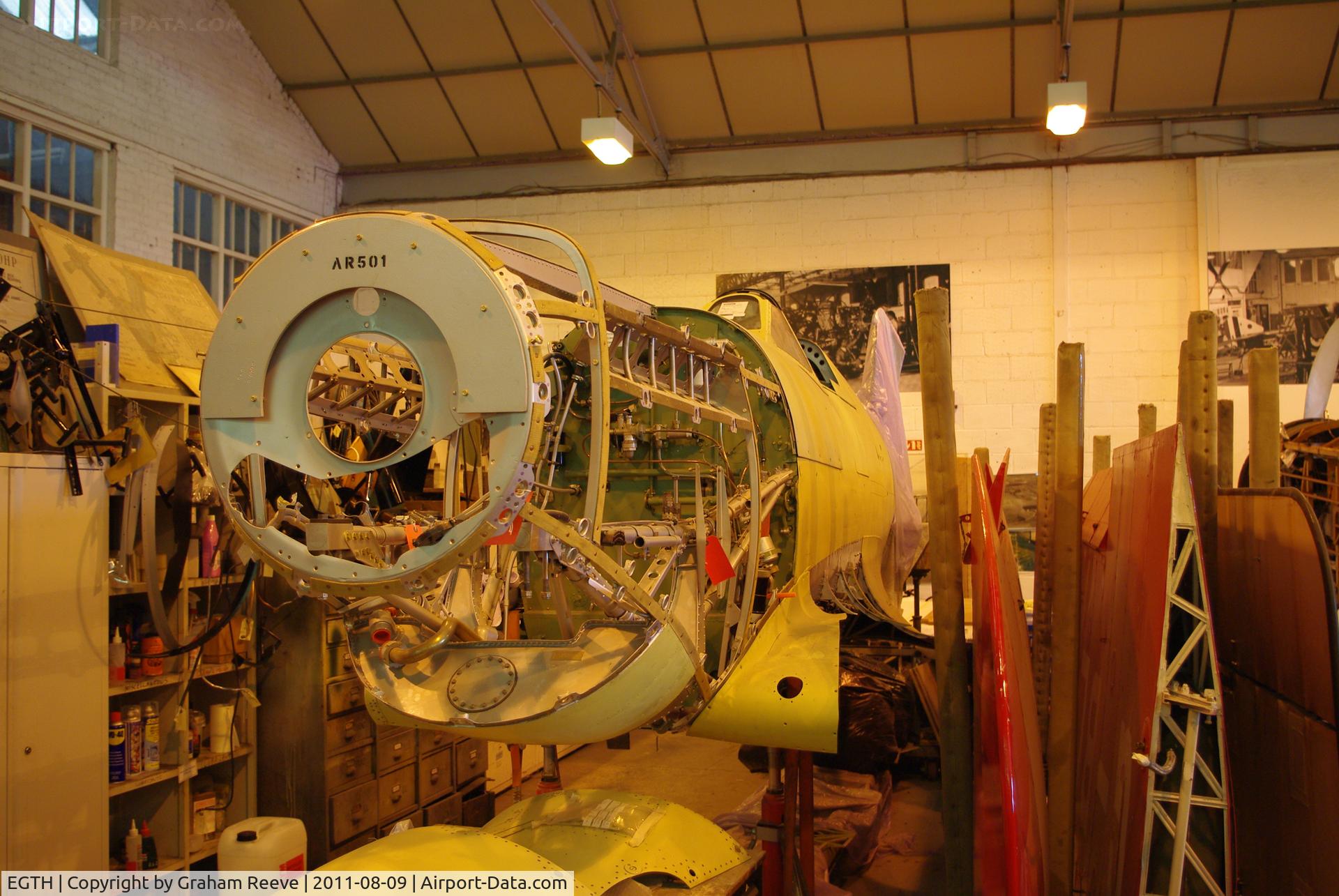EGTH Airport - Spitfire under restoration at Shuttleworth.