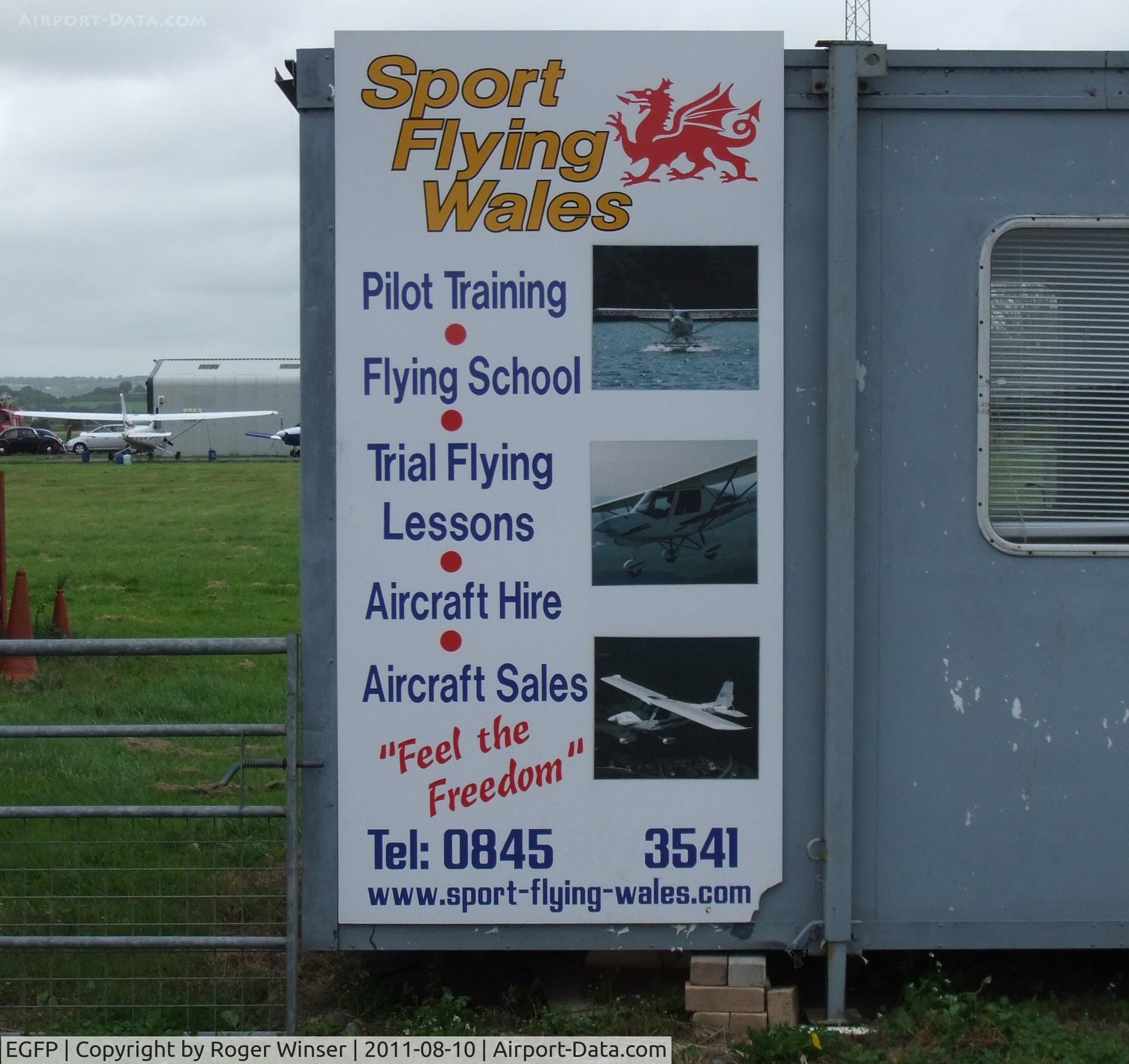 Pembrey Airport, Pembrey, Wales United Kingdom (EGFP) - Advert for flying school.