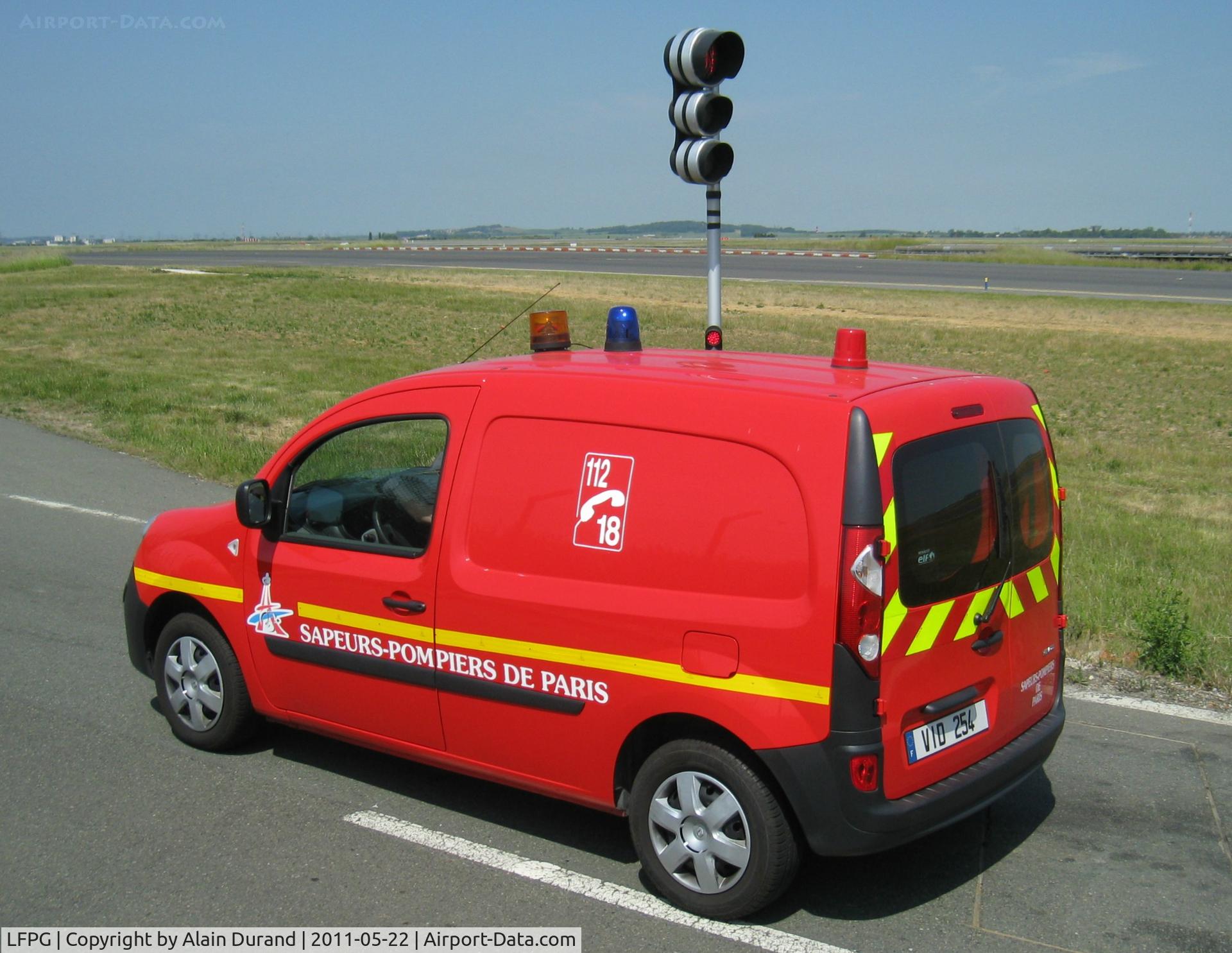 Paris Charles de Gaulle Airport (Roissy Airport), Paris France (LFPG) - Even the fire brigade must observe the red light here. The small van is an homebuilt Renault Kangoo