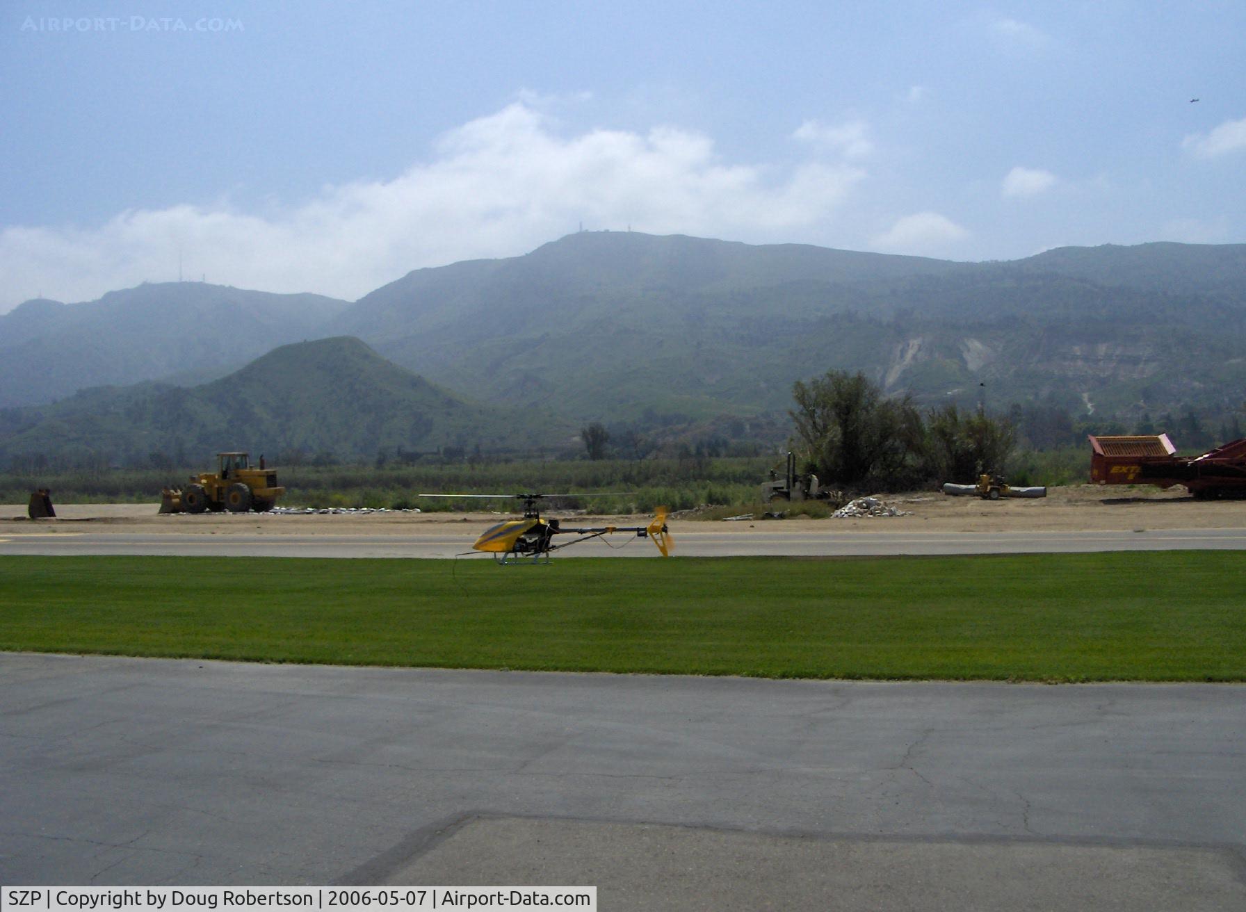 Santa Paula Airport (SZP) - T-REX radio-controlled helicopter flying downwind