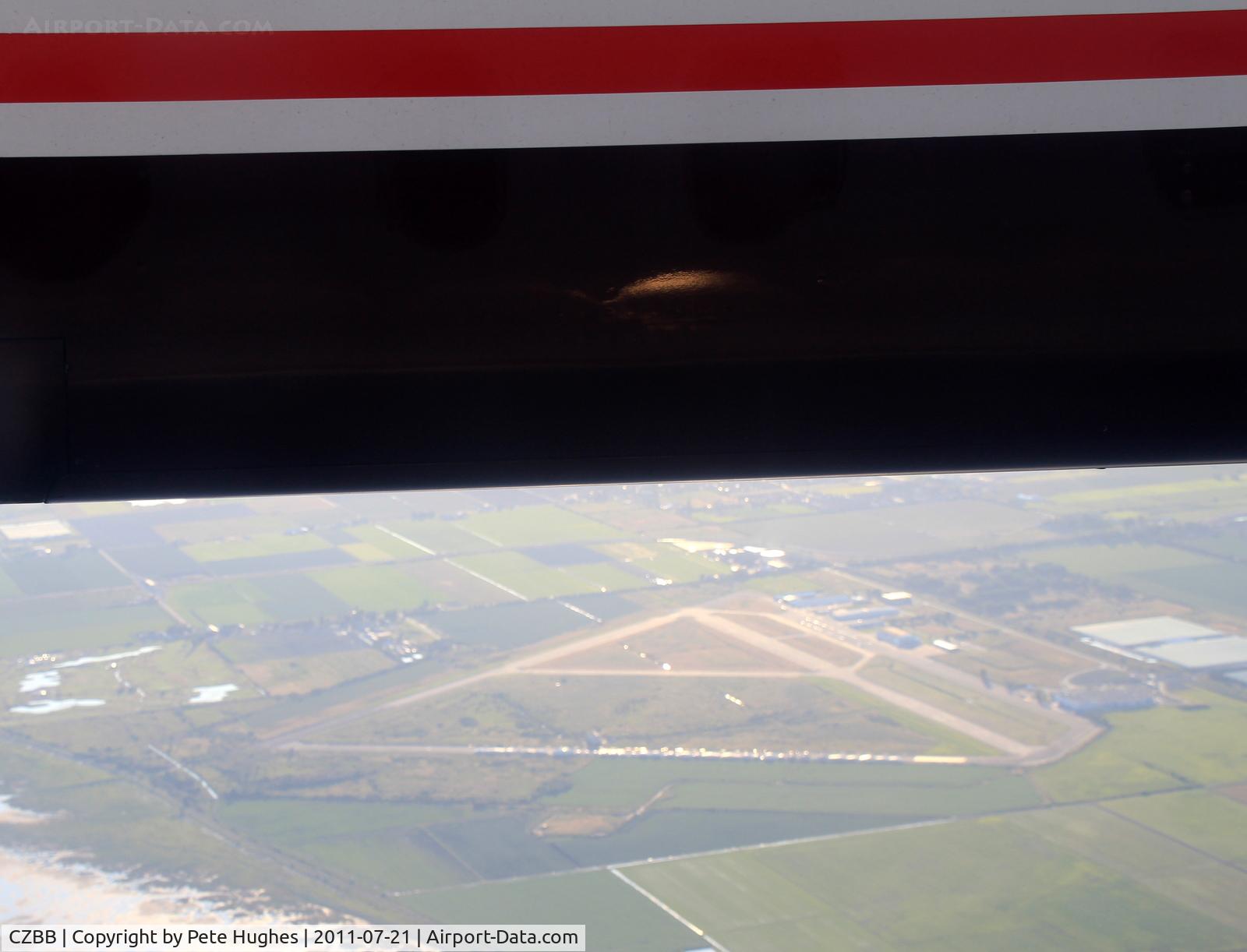 Boundry Bay Airport, Boundry Bay Canada (CZBB) - Boundary Bay, south of Vancouver, seen below the engine cowling of N431QX DHC8 flying SEA to YVR. 