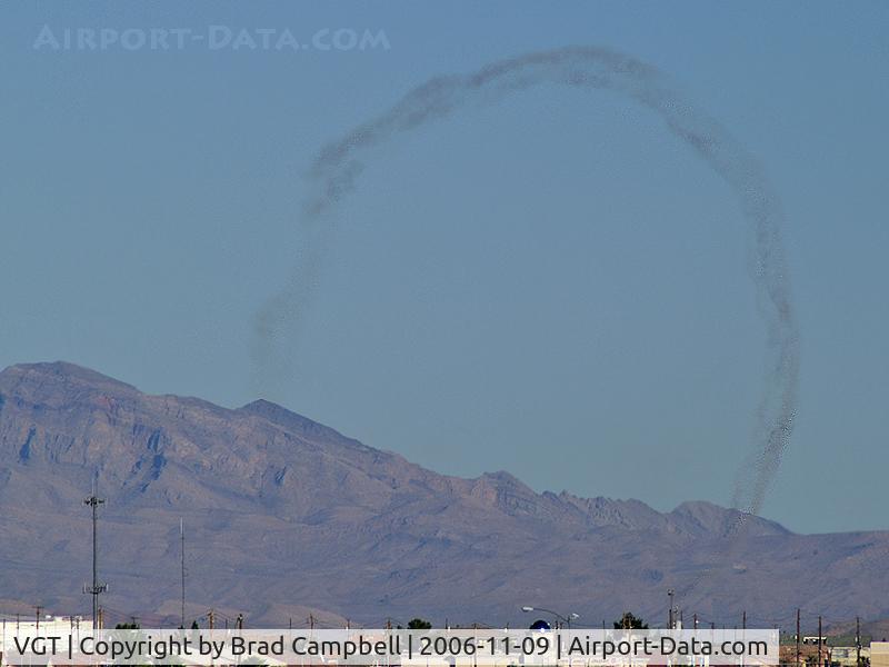 North Las Vegas Airport (VGT) - Smoke trails left from aircraft practicing for Aviation Nation 2006. Seen from about 10 miles away.