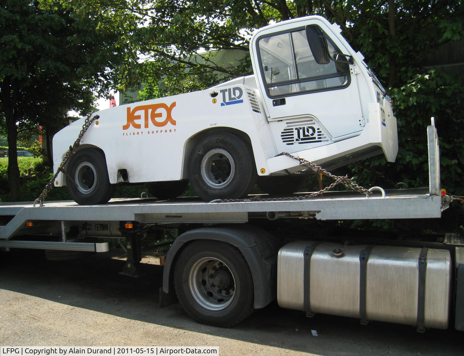 Paris Charles de Gaulle Airport (Roissy Airport), Paris France (LFPG) - Still strapped on the delivery flatbed trailer, and looking not in a hurry to hit the aprons and start a collection of dents !