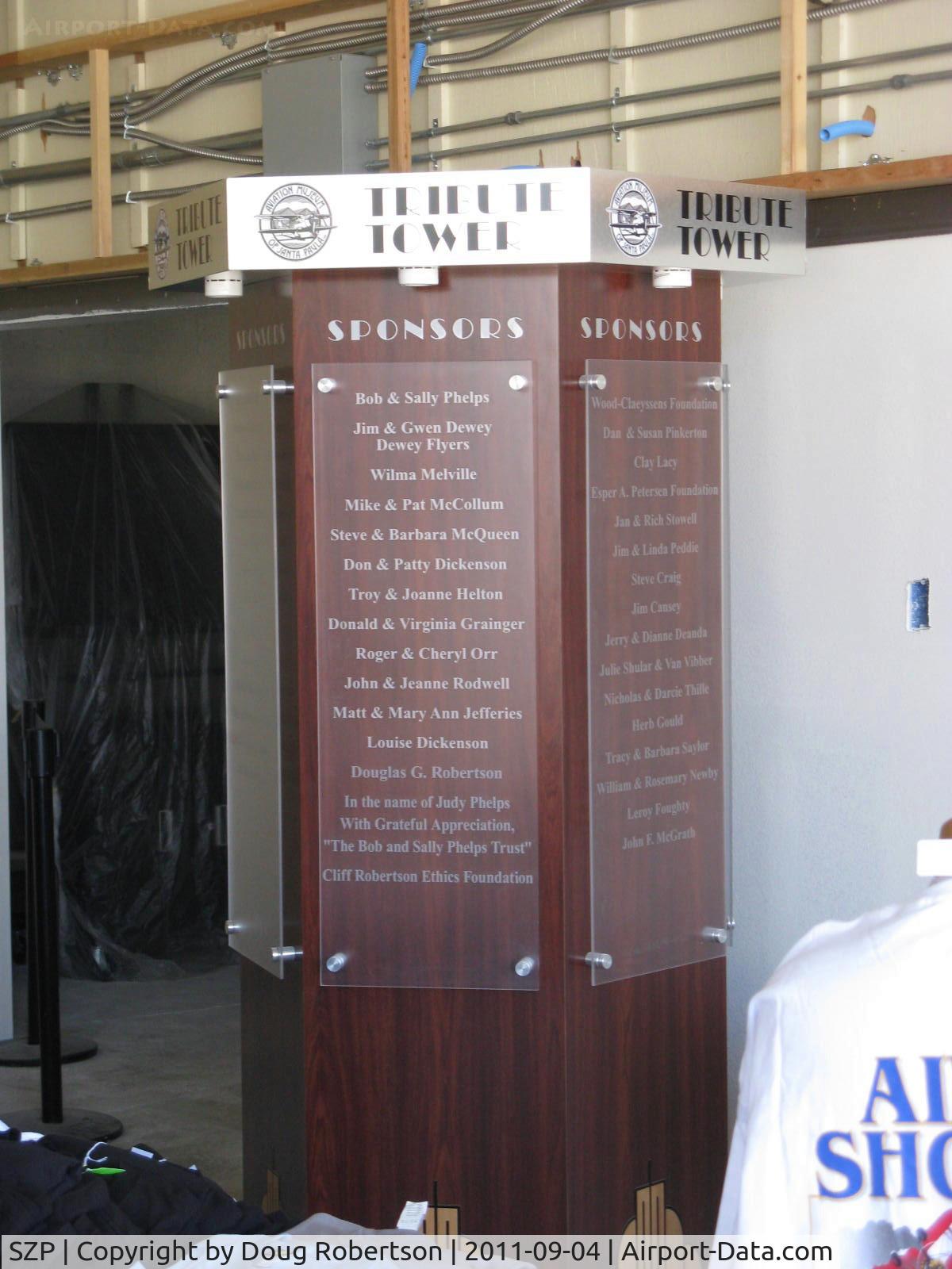 Santa Paula Airport (SZP) - Aviation Museum of Santa Paula-Main hangar under construction. Tribute Tower of Sponsors, multi-sided-partial shown. Please consider making a contribution.