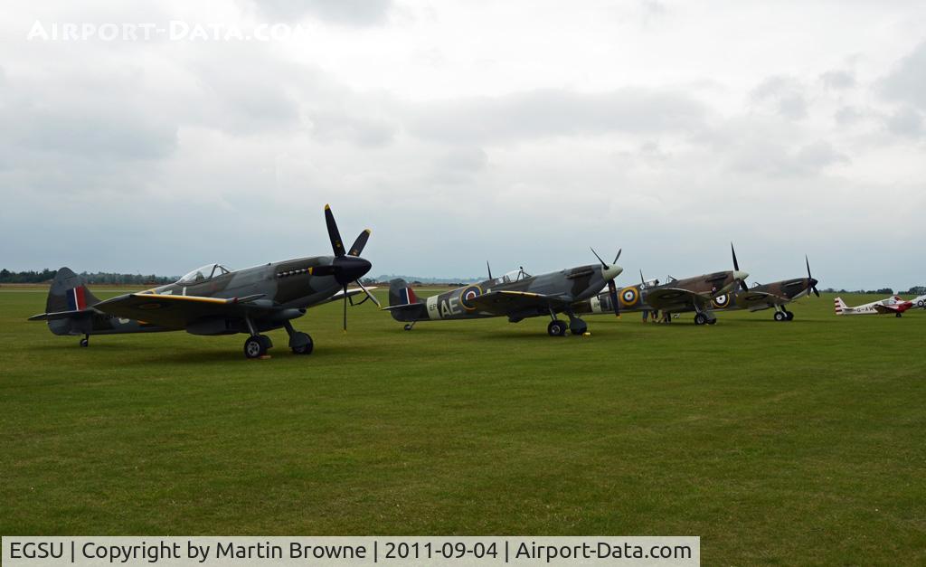 Duxford Airport, Cambridge, England United Kingdom (EGSU) - SPITFIRES ON THE FLIGHTLINE ON A VERY DULL AND RAINY DAY.