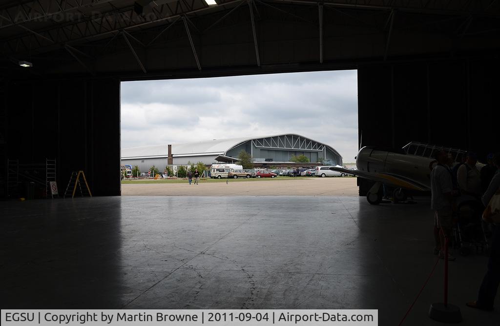 Duxford Airport, Cambridge, England United Kingdom (EGSU) - VIEW OF THE IMPERIAL WAR MUSEUM HANGAR ON A VERY WET AND DULL DAY.