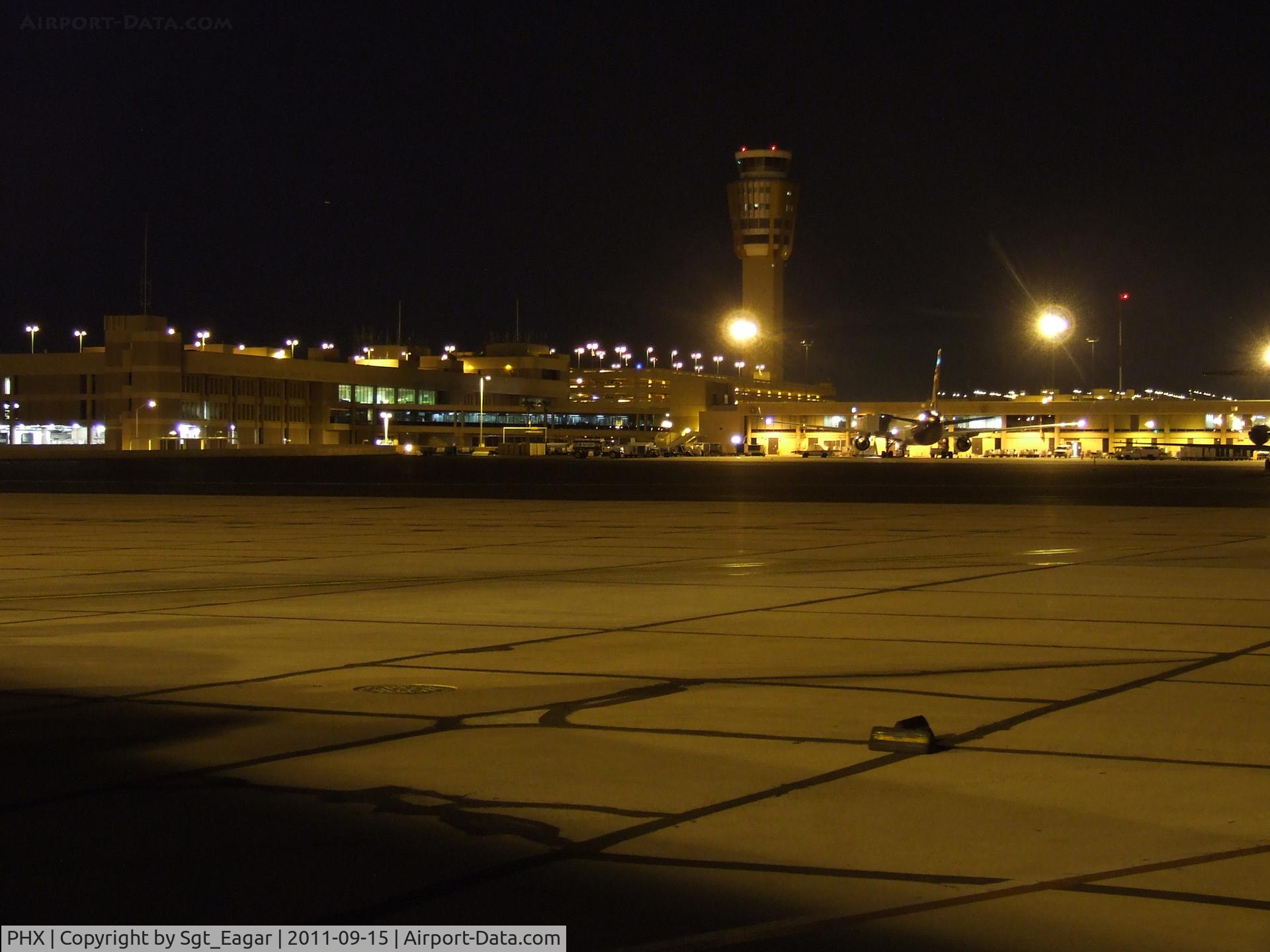 Phoenix Sky Harbor International Airport (PHX) - Tower shot with Hawaiian Airline 767 in the foreground