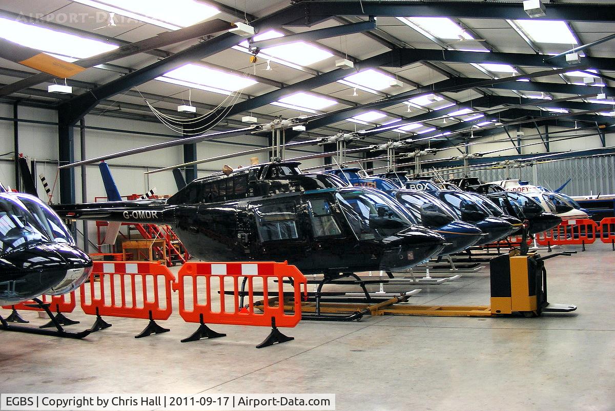 Shobdon Aerodrome Airport, Leominster, England United Kingdom (EGBS) - lineup of Bell 206 Jetrangers in the Tiger Helicopter's hangar at Shobdon