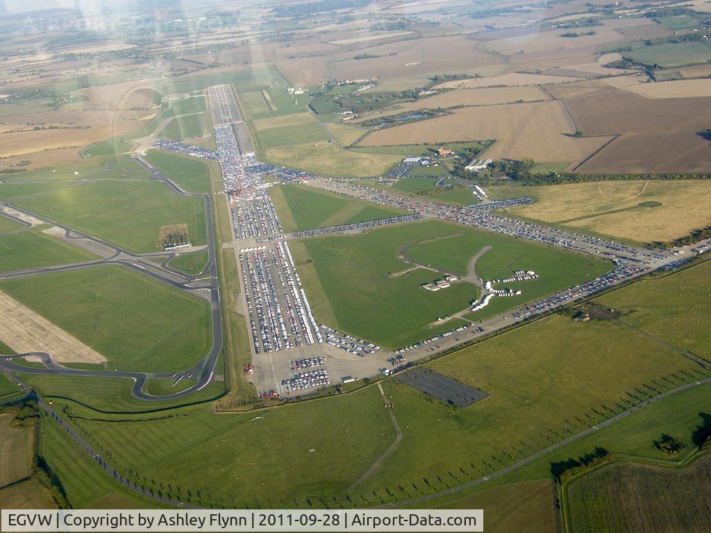 EGVW, RAE Bedford, Thurleigh. Now disused however part of the runway is still used by aircraft in attendance in relation to bedford autodrome. Vehicles are now stored on the disused runway.