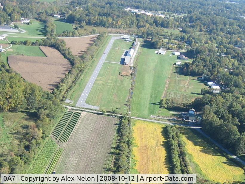 Hendersonville Airport (0A7) - Looking down runways 15 ... half is paved and half is grass. The paved portion is 50' wide - there is a 50' wide grass portion of that same runway. To the right in the picture is a private, parallel grass runway on the west side of a row of hangars.