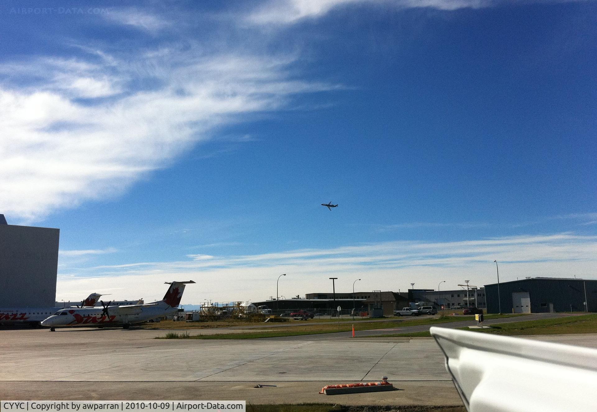 Calgary International Airport, Calgary, Alberta Canada (CYYC) - Third picture of this set  Nav Canada jet flying low - He gets paid to do this.  No fair. I am surprised at how quiet the engines are.