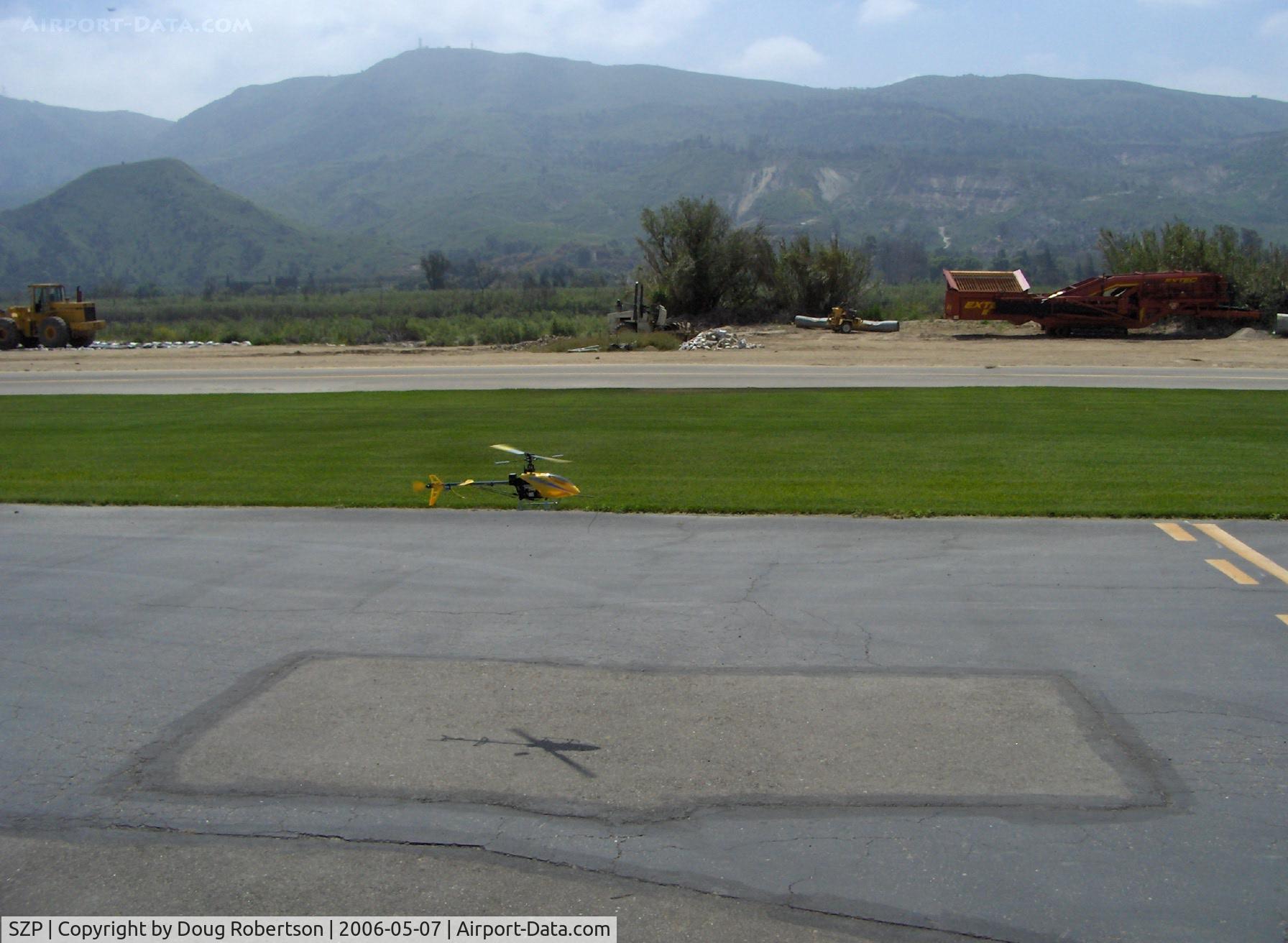 Santa Paula Airport (SZP) - T-REX radio-controlled helicopter flying upwind