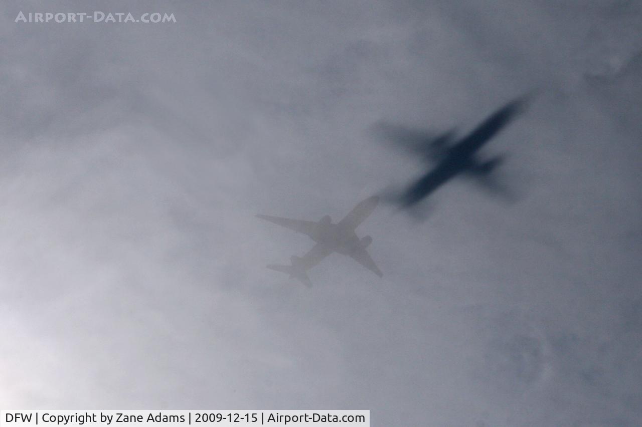 Dallas/fort Worth International Airport (DFW) - Interesting shadow on the low thin cloud cover...on approach to DFW.