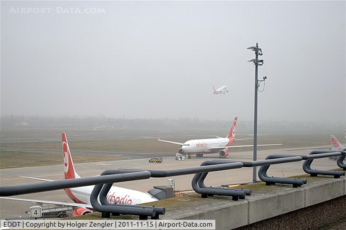 Tegel International Airport (closing in 2011), Berlin Germany (EDDT) - It was a wet day and it was a cold day, but I persist on that visitors terrace to offer you this picture now!