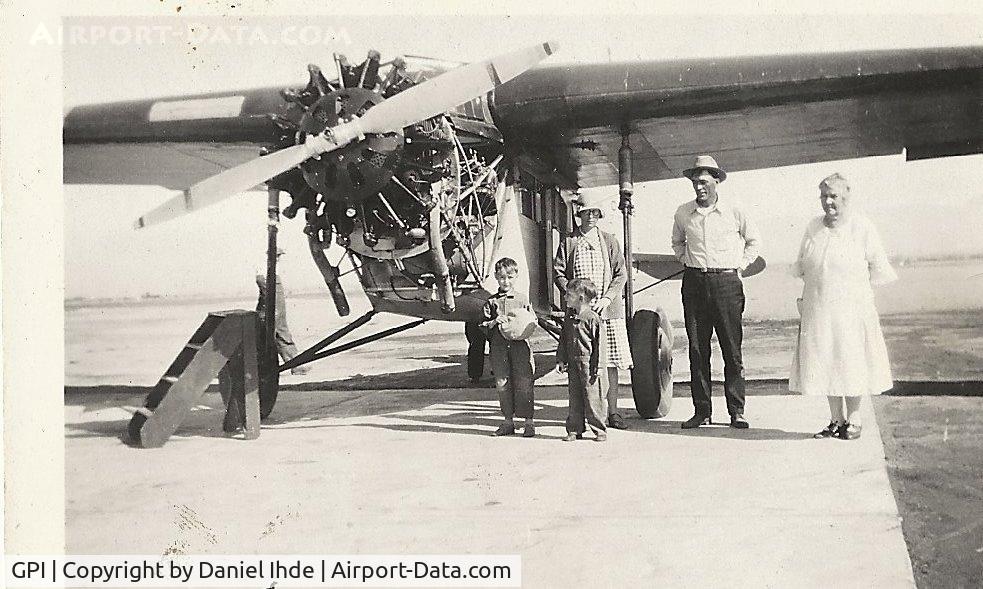Glacier Park International Airport (GPI) - Fokker Super Universal.  Taken in 1930 @ Kalispell Mt. Airport  Pictured are my dad (Ray) 5 y.o., uncle Earl, and grandparents August and Ellen Ihde along with a friend.