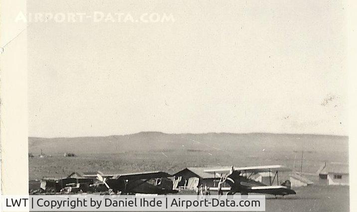 Lewistown Municipal Airport (LWT) - 1935 60 miles east of Lewistown Mt.  One penny per pound rides.  These planes landed on the ranch where my dad grew up because of the flat terrain.