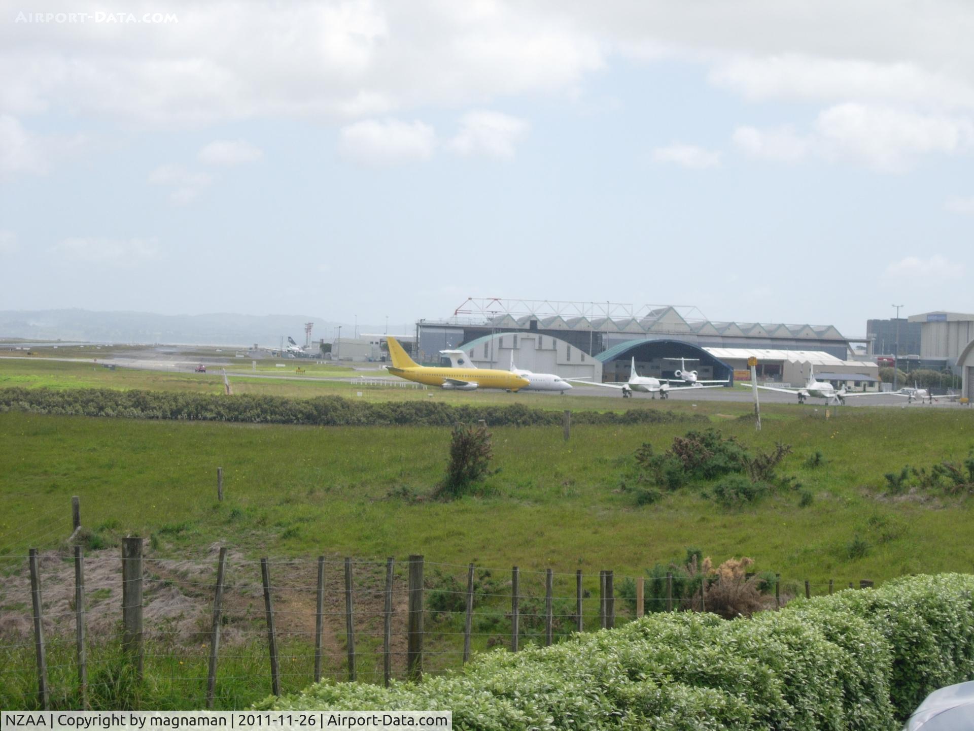 Auckland International Airport, Auckland New Zealand (NZAA) - View of cargo and biz jet apron from one of the viewing areas just to the east of the airport on the road to Manukau.

Good place for photos if landing towards the west.