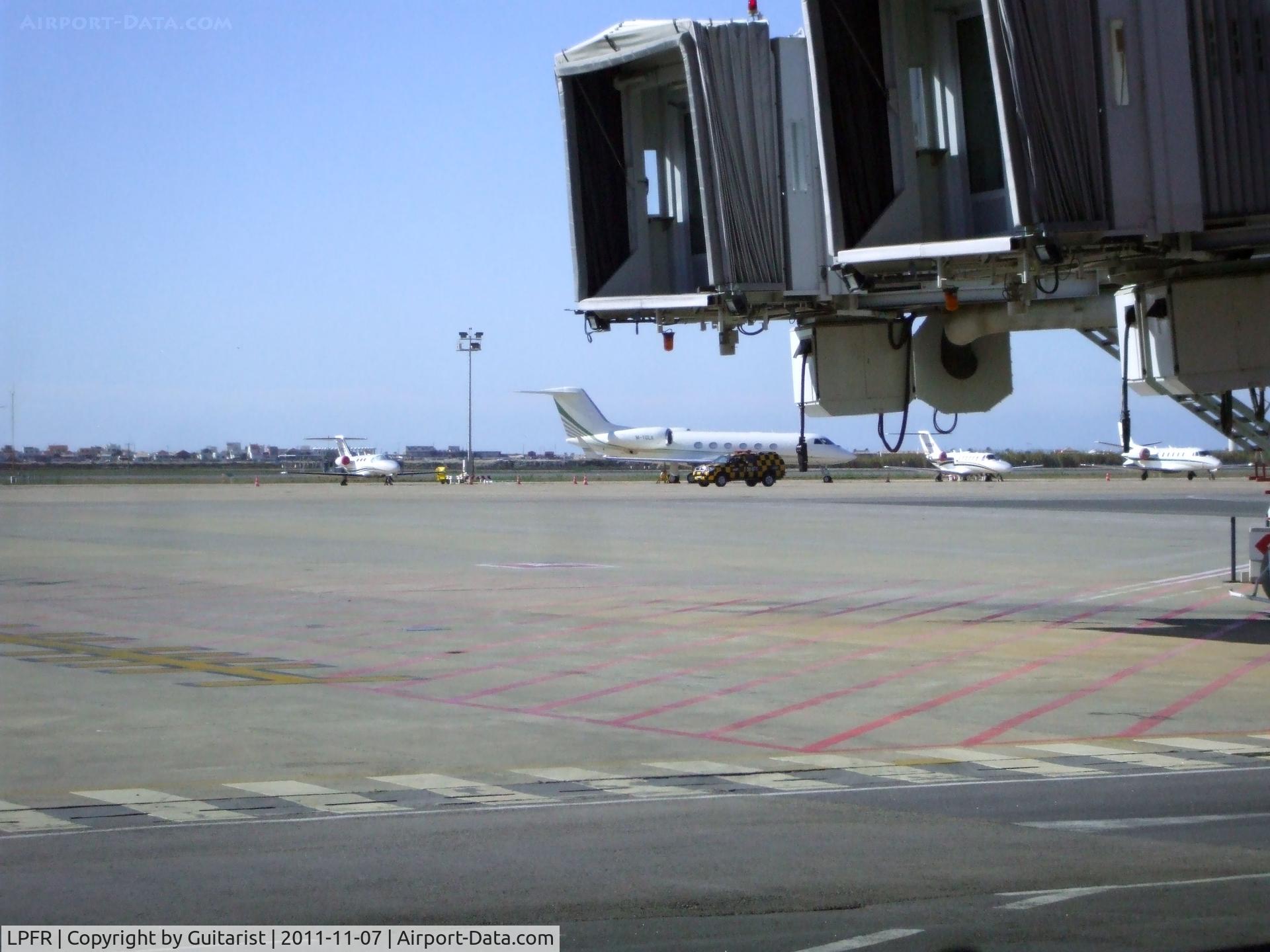 Faro Airport, Faro Portugal (LPFR) - On my way home, looking out over the ramp at Faro 