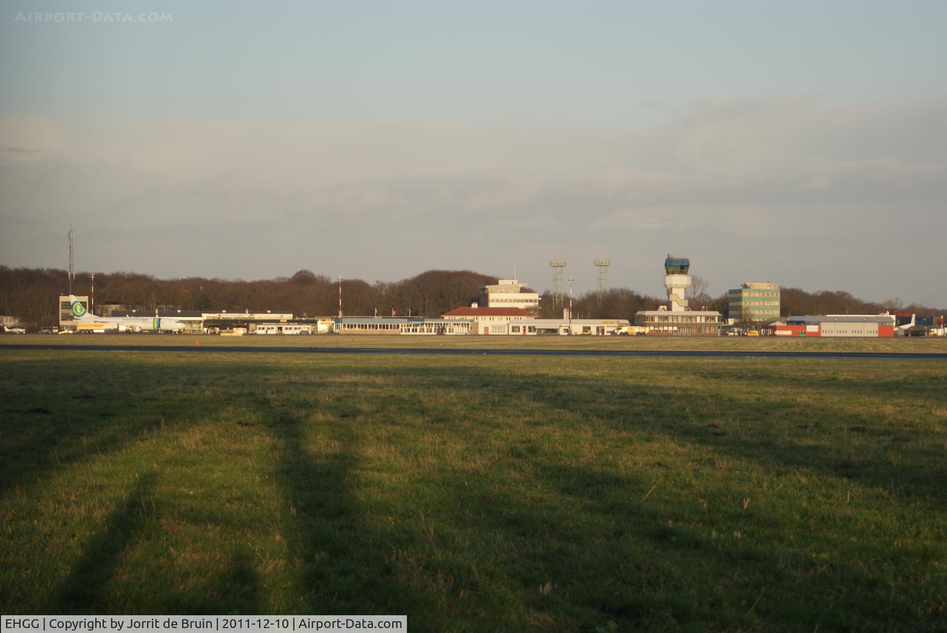 Groningen Airport Eelde, Eelde Netherlands (EHGG) - Skyline of the apron of EHGG included the tower, terminal and a Transavia aircraft. 