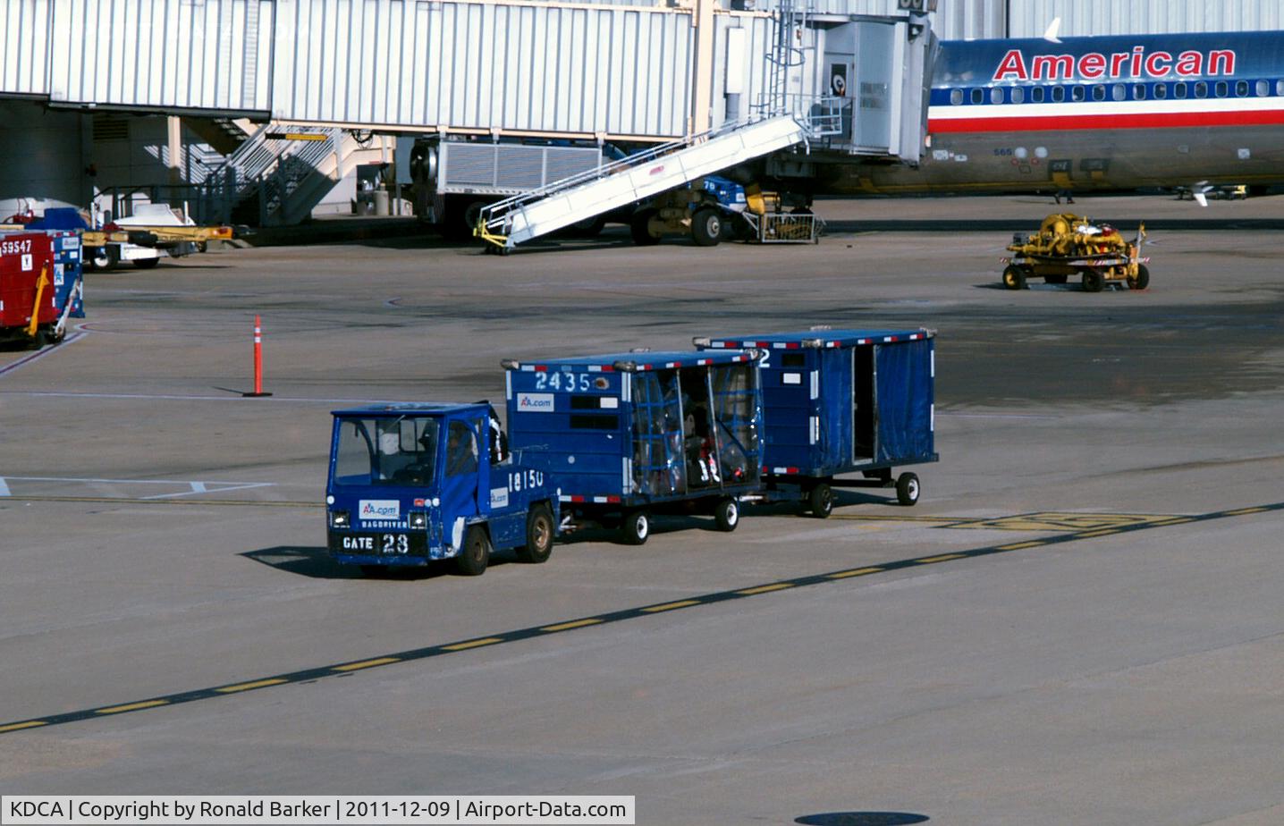 Ronald Reagan Washington National Airport (DCA) - Tug with # 18150 baggage carts on the ramp