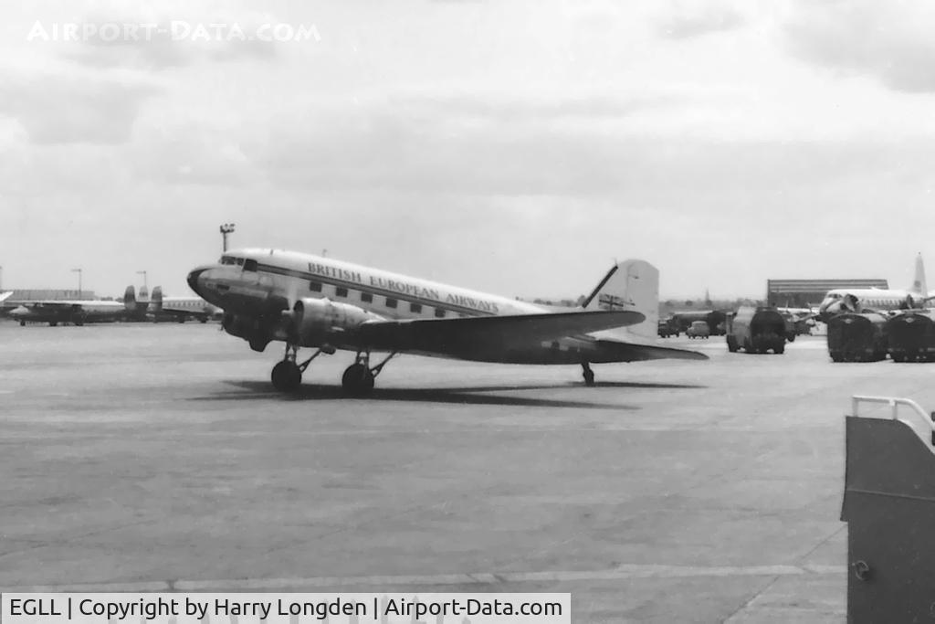 London Heathrow Airport, London, England United Kingdom (EGLL) - An unidentified BEA Douglas C-47 Royal Mail aircraft at Heathrow Airport, London in 1955 taxiing to departure. Similar to the previous image but includes in the background two Vickers Viscounts and an Airspeed Ambassador.