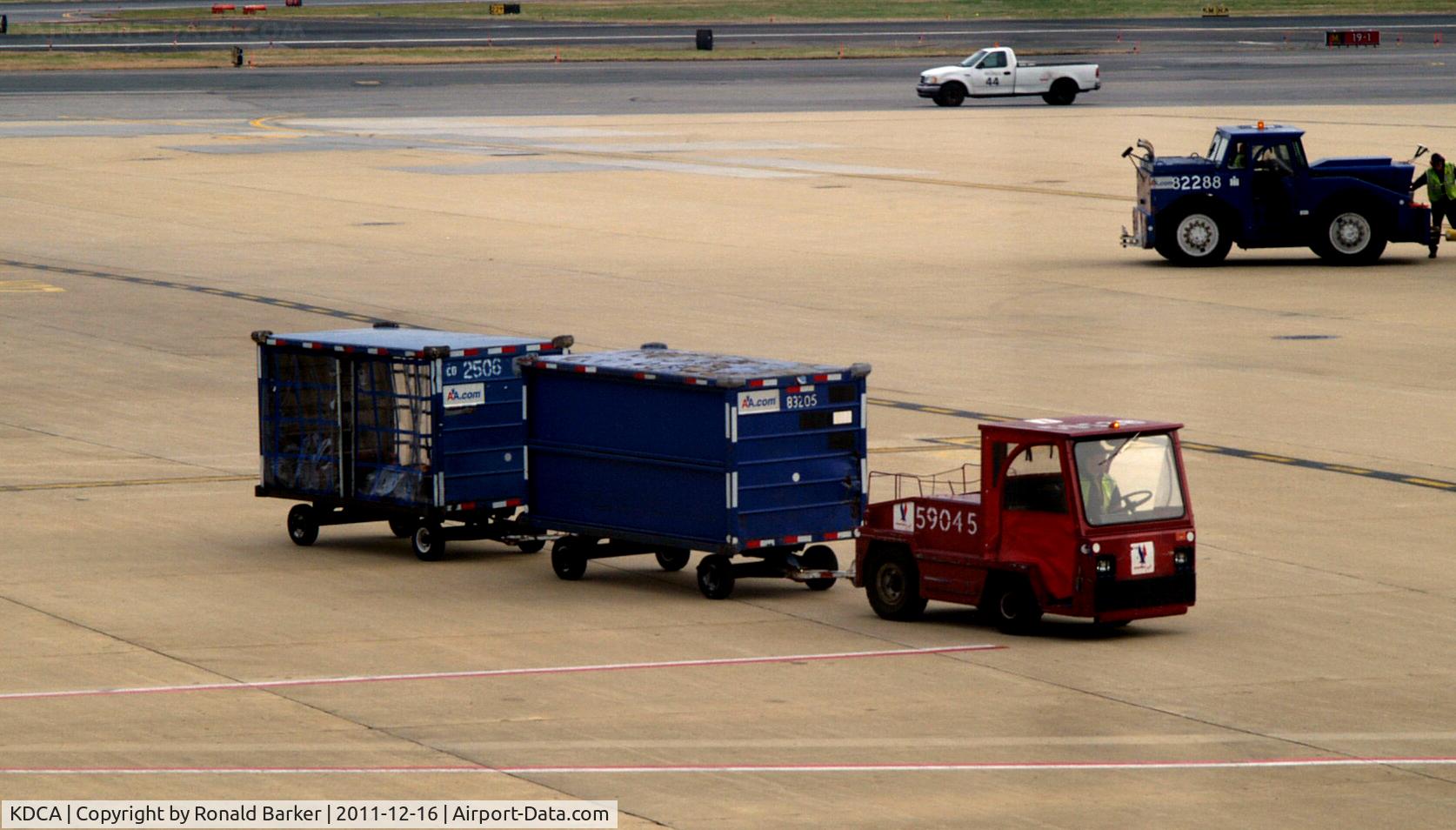 Ronald Reagan Washington National Airport (DCA) - Red tug # 59045 with bags