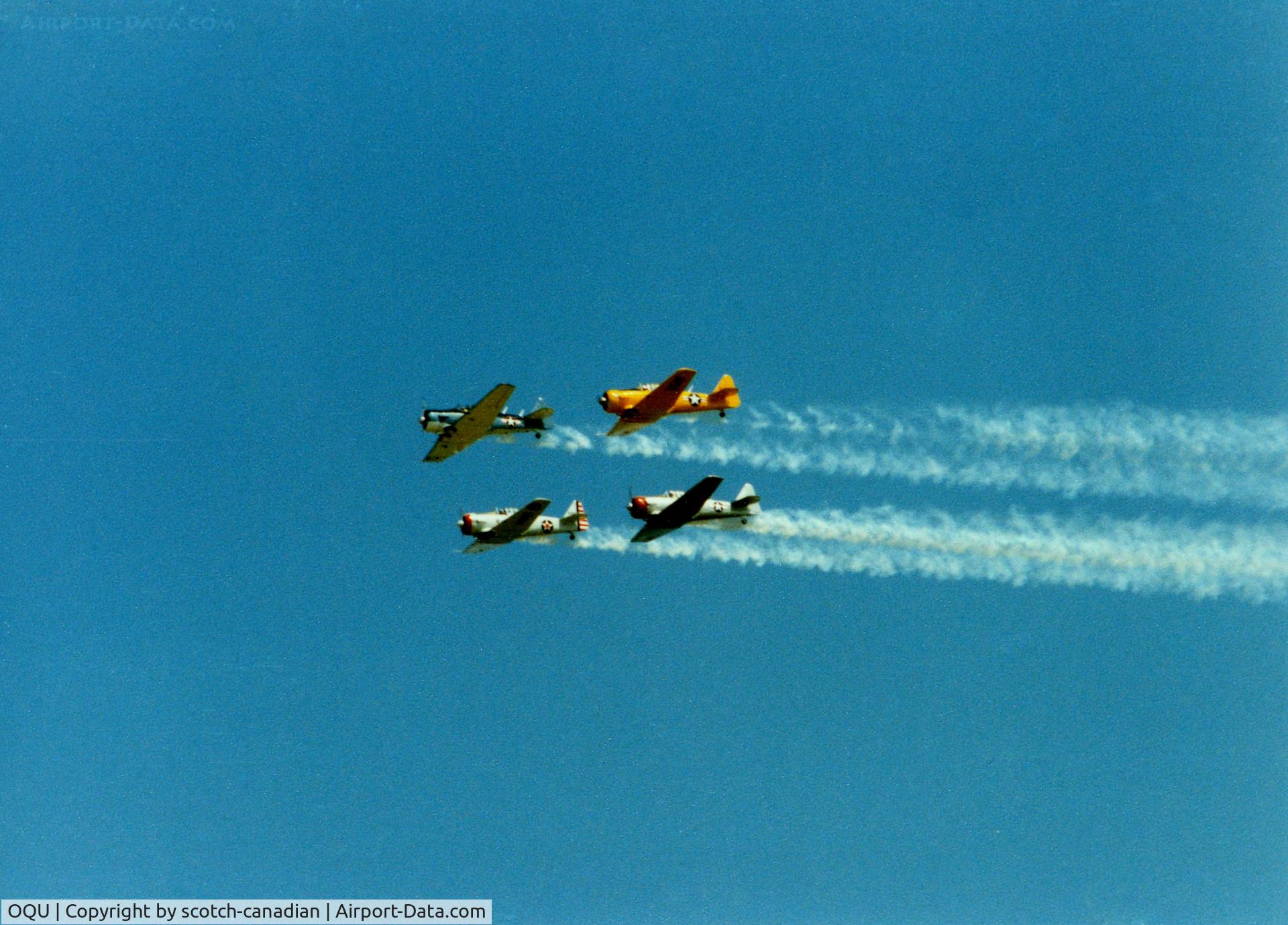 Quonset State Airport (OQU) - North American AT-6/SNJ's at Quonset State Airport, North Kingstown, RI - circa 1980's