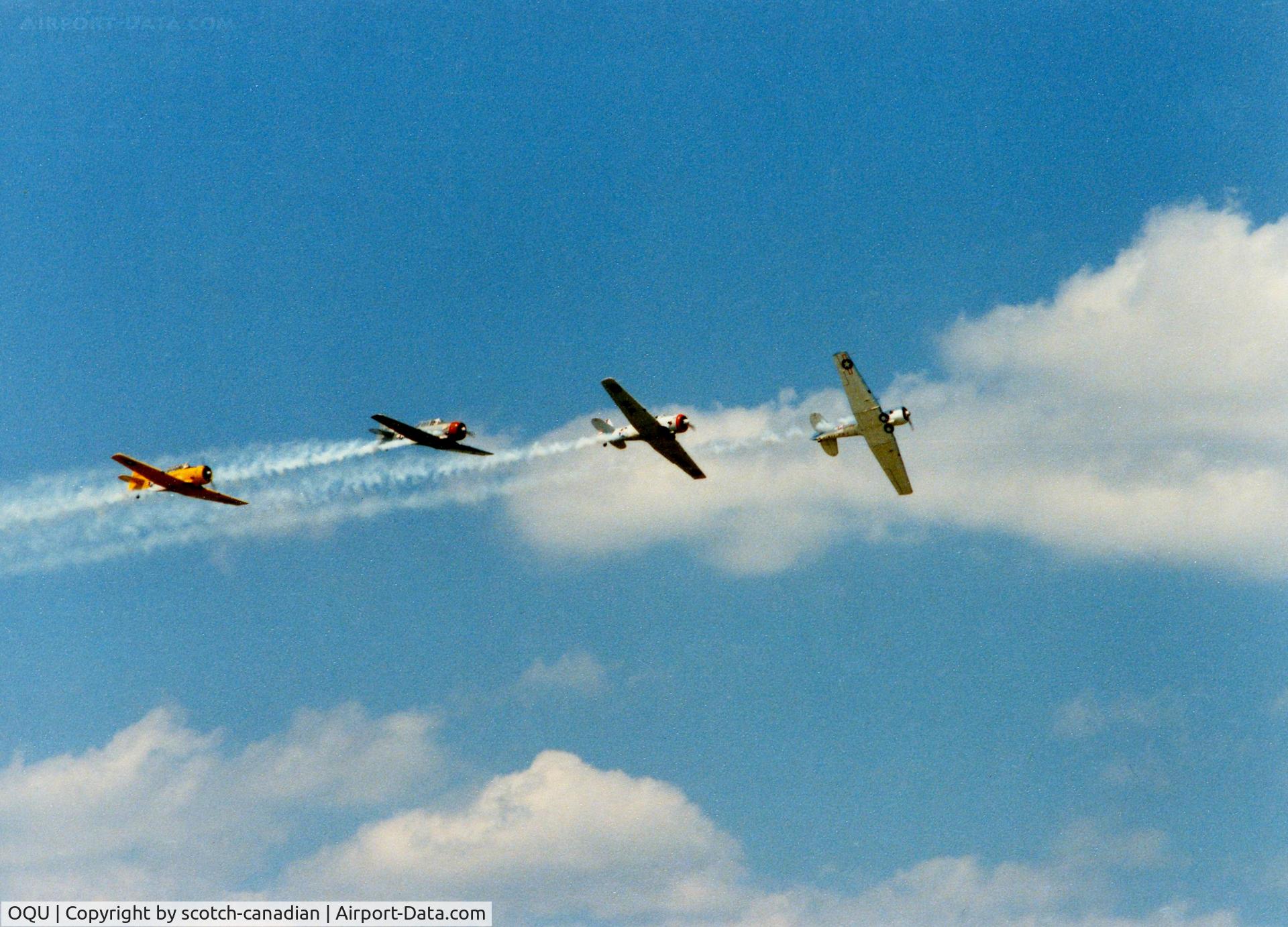 Quonset State Airport (OQU) - North American AT-6/SNJ's at Quonset State Airport, North Kingstown, RI - circa 1980's