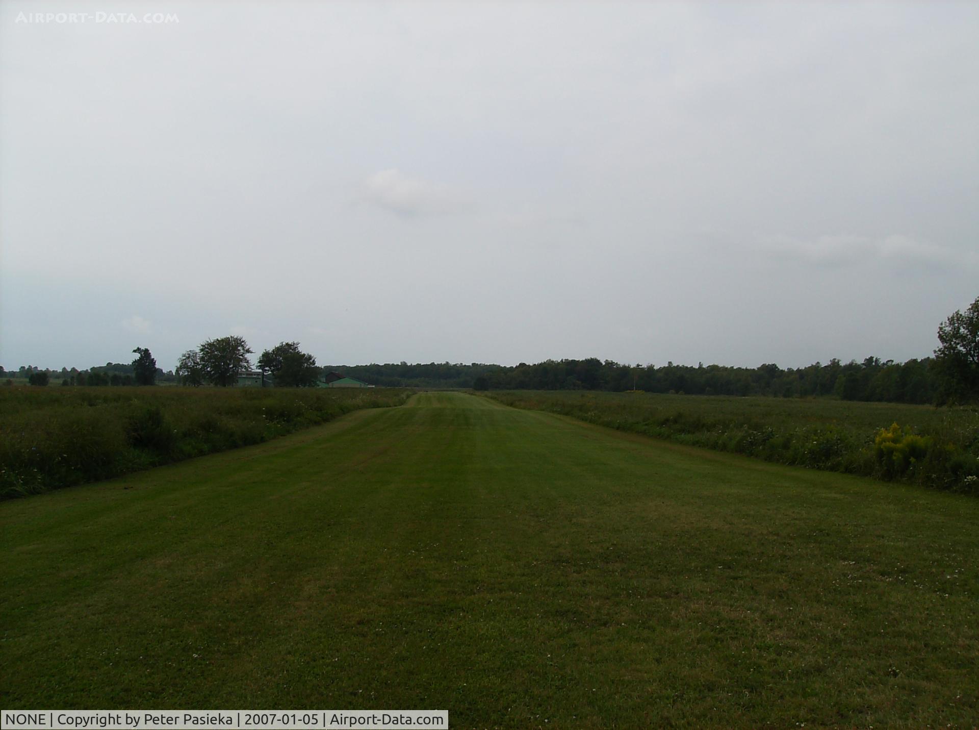 NONE Airport - Private runway, Southern Ontario Canada, right besides Lake Erie & not too far from the Mimico Power Plant
We visited a friend who owns the field, runway is only about 1600 feet.