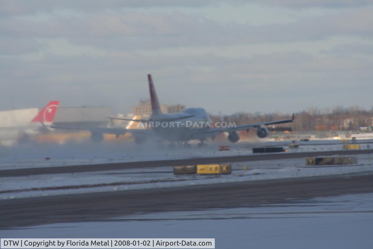 Detroit Metropolitan Wayne County Airport (DTW) - Northwest 747-400 taking off creating a blizzard