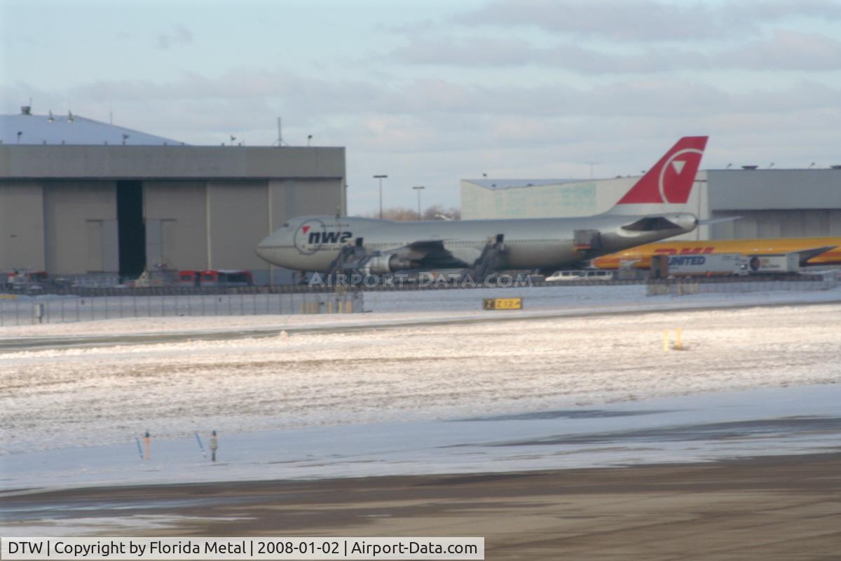 Detroit Metropolitan Wayne County Airport (DTW) - Northwest 747-200 - used for victorious University of Michigan football players vs. Florida Gators after arriving from MCO.