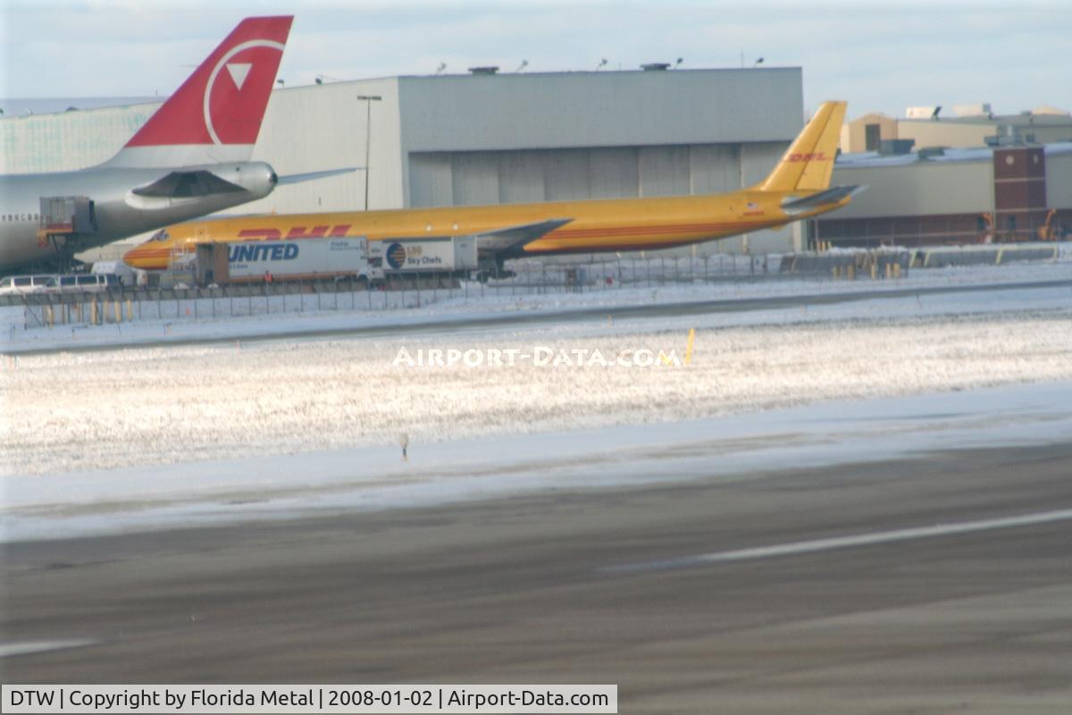 Detroit Metropolitan Wayne County Airport (DTW) - DHL DC-8-70 and tail of NWA 747-200