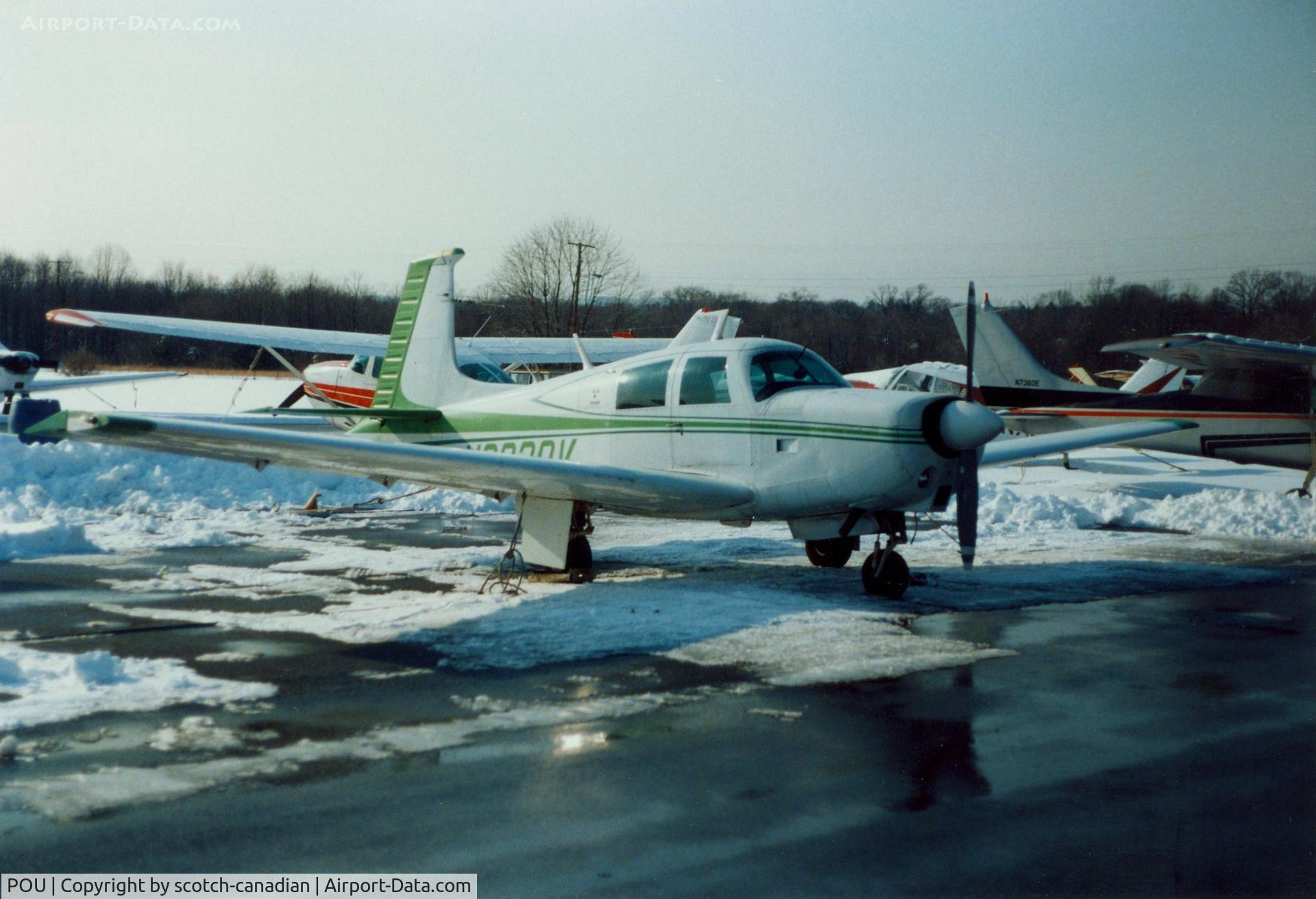 Dutchess County Airport (POU) - Mooney Aircraft parked at Dutchess County Airport, Poughkeepsie, NY - circa 1980's